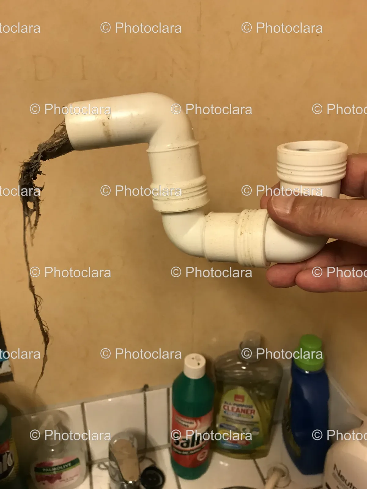 Hand-Holding-White-Pipe-with-Dirt.jpg