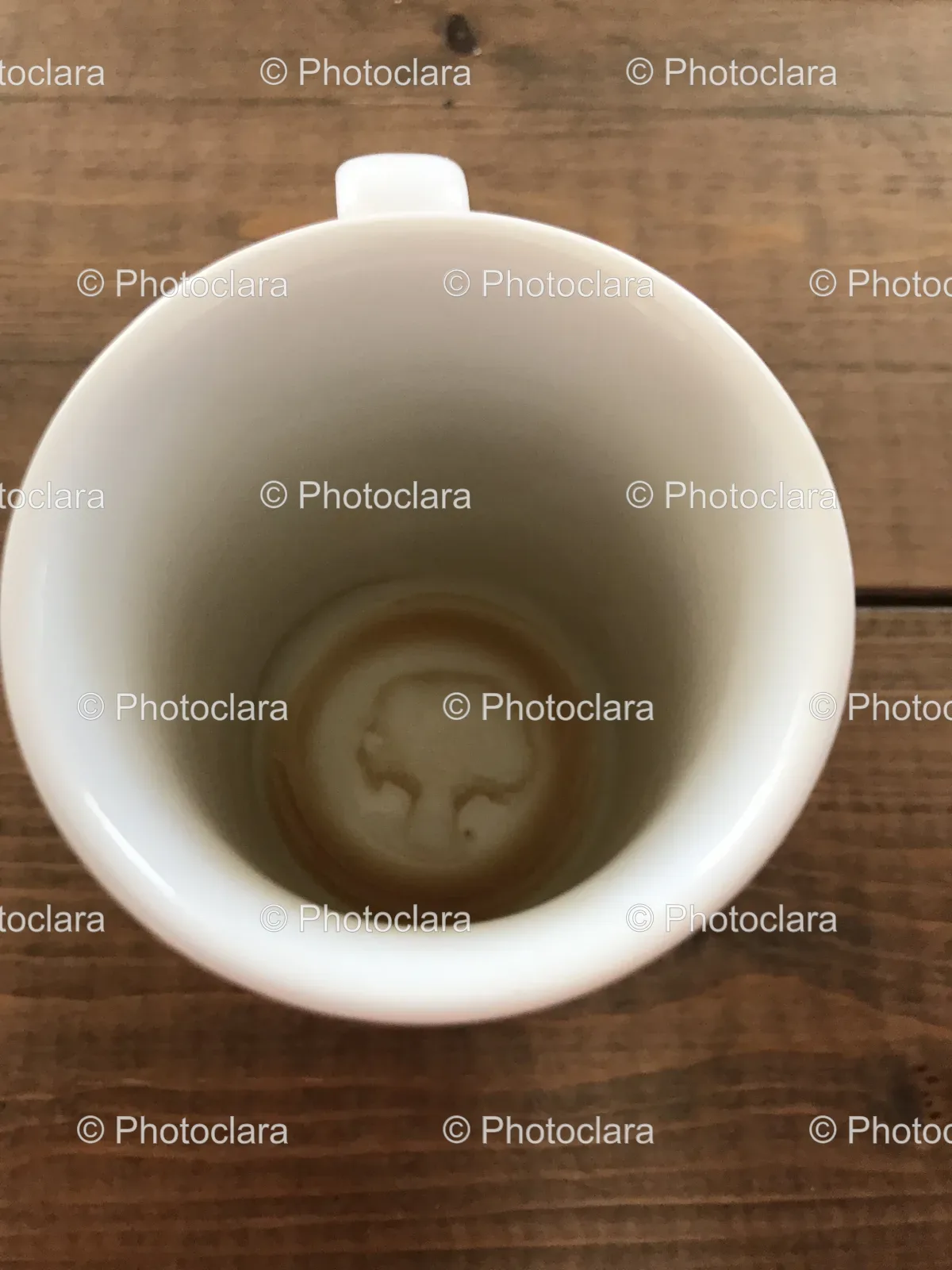 white-ceramic-coffee-cup-on-wooden-surface.jpg