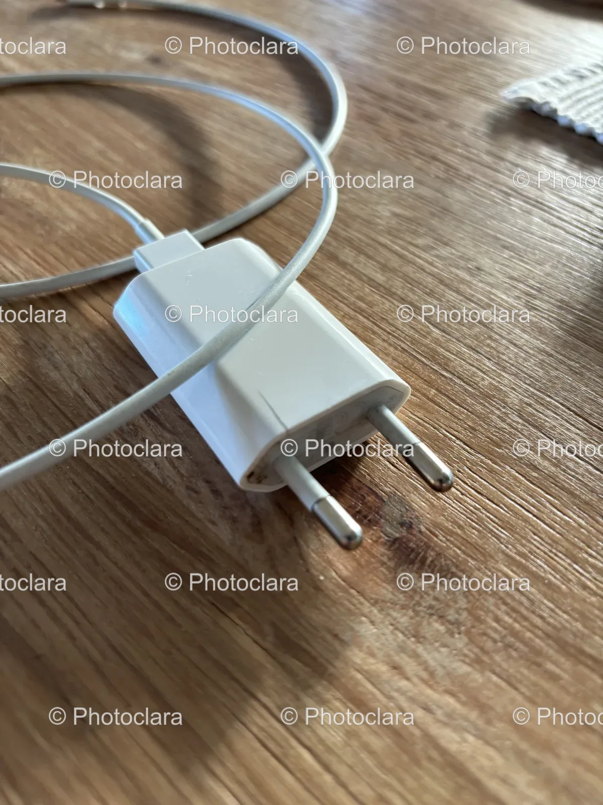 white-charger-plugged-into-cord.jpg