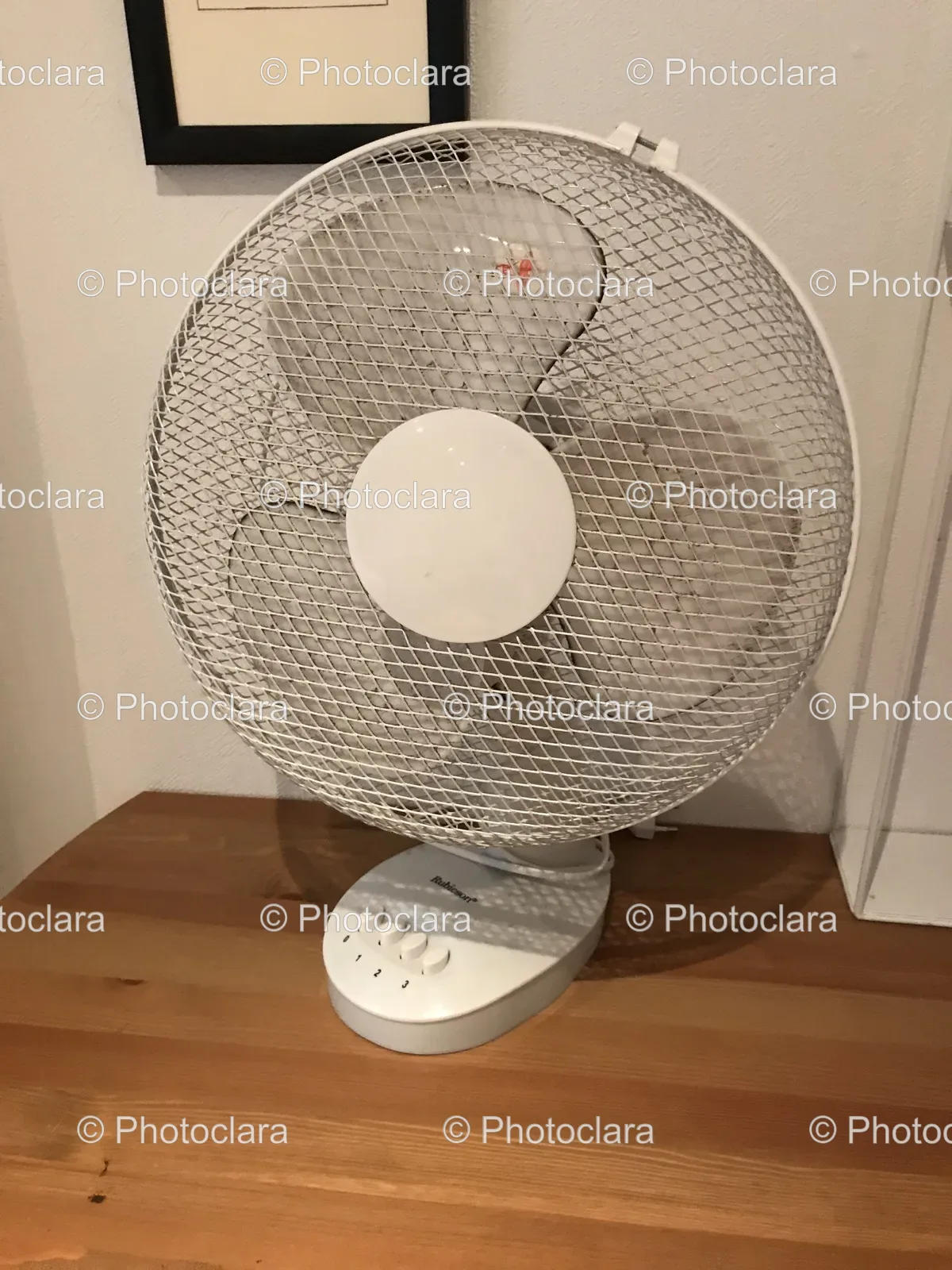 White-Fan-on-Wood-Surface.jpg