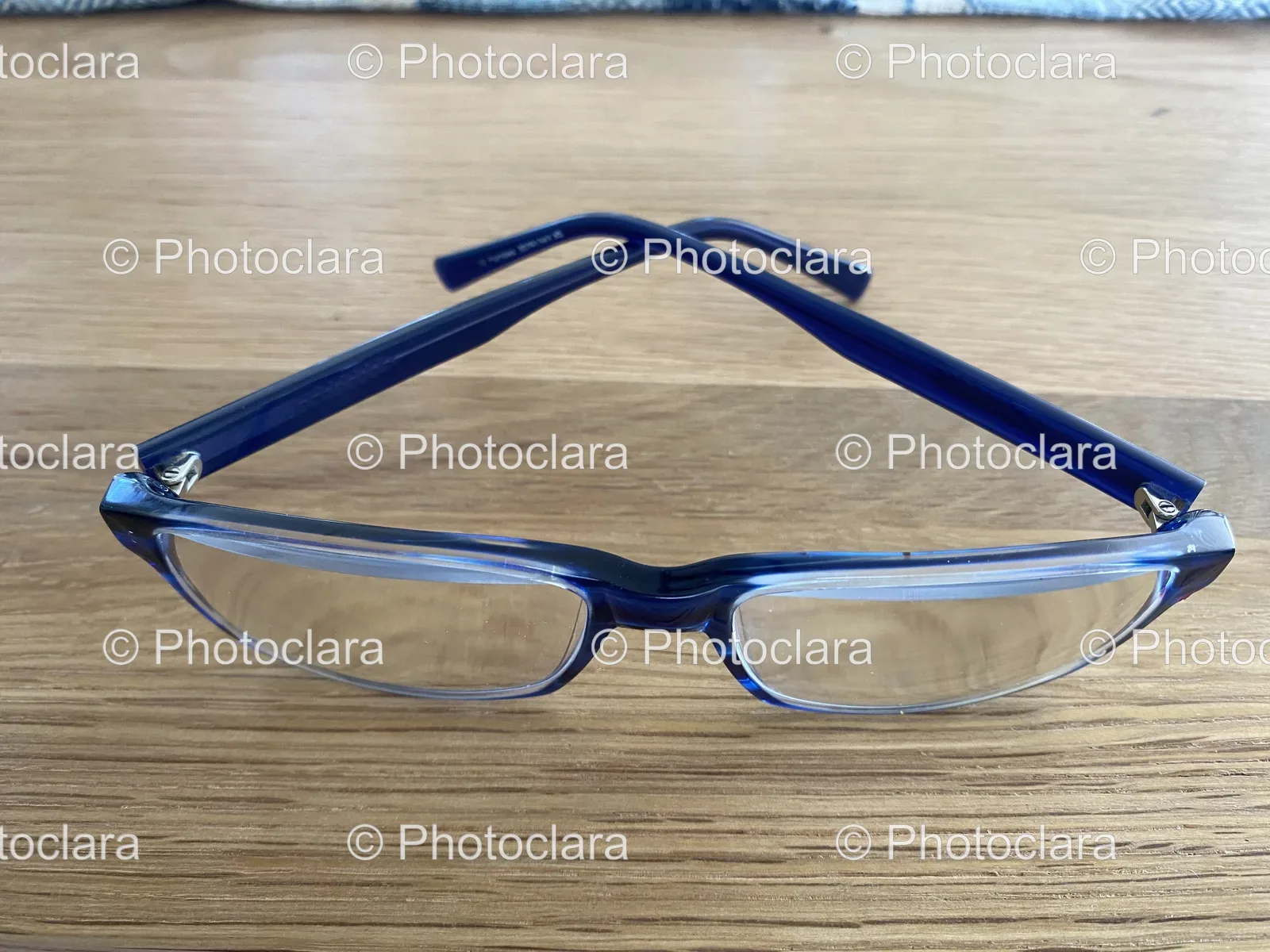 blue-glasses-on-wooden-surface.jpg