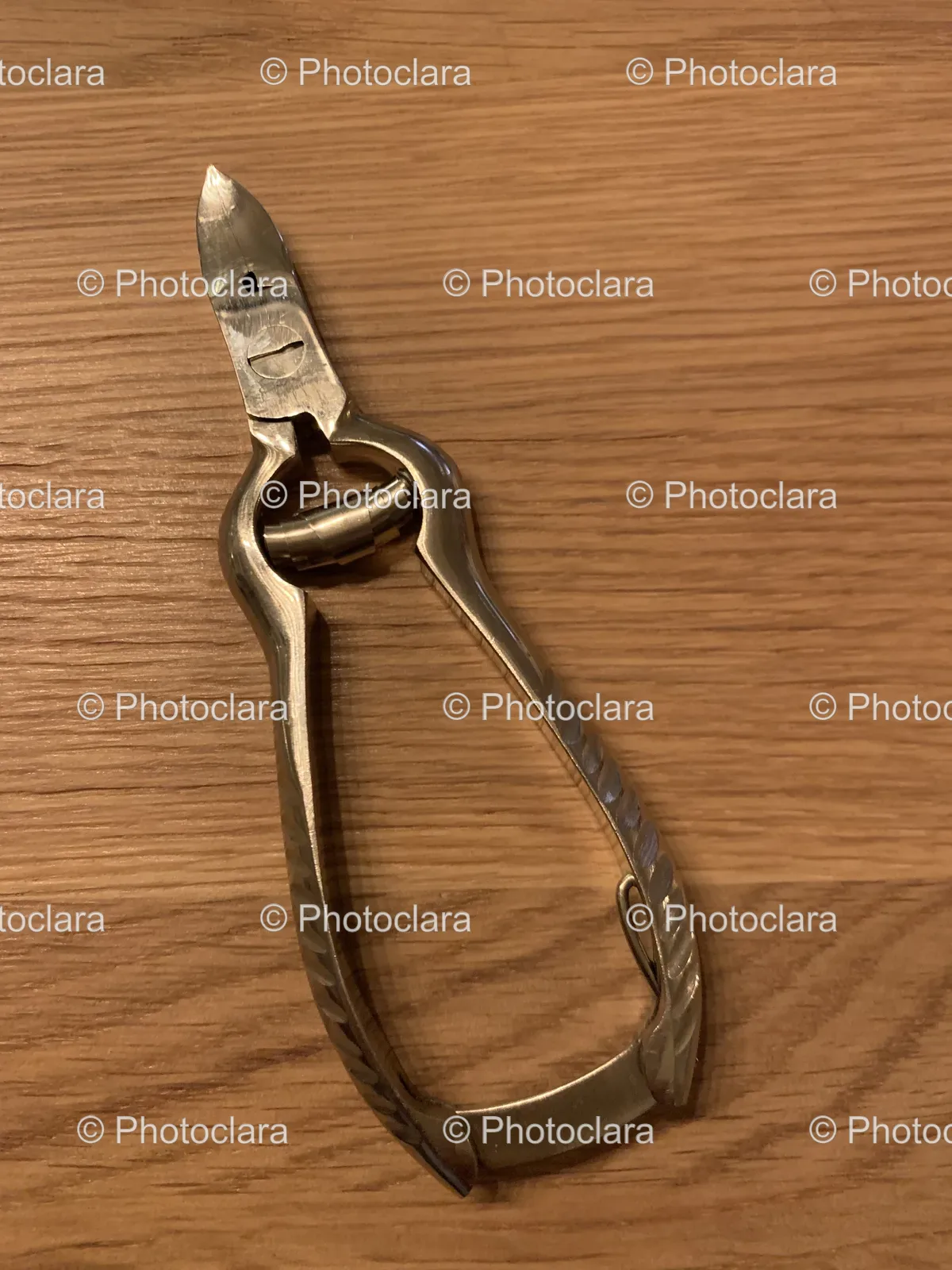 Metal-Nail-Clipper-on-Wooden-Surface.jpg