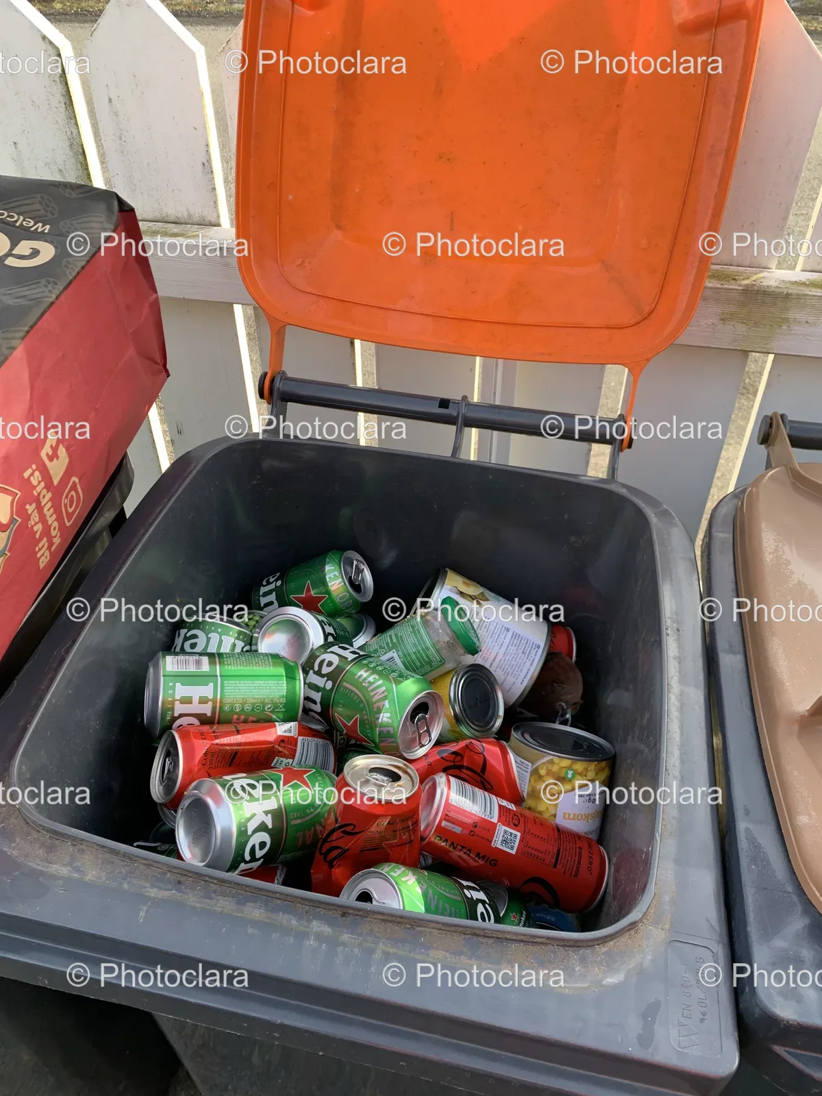overflowing-trash-can-with-cans.jpg