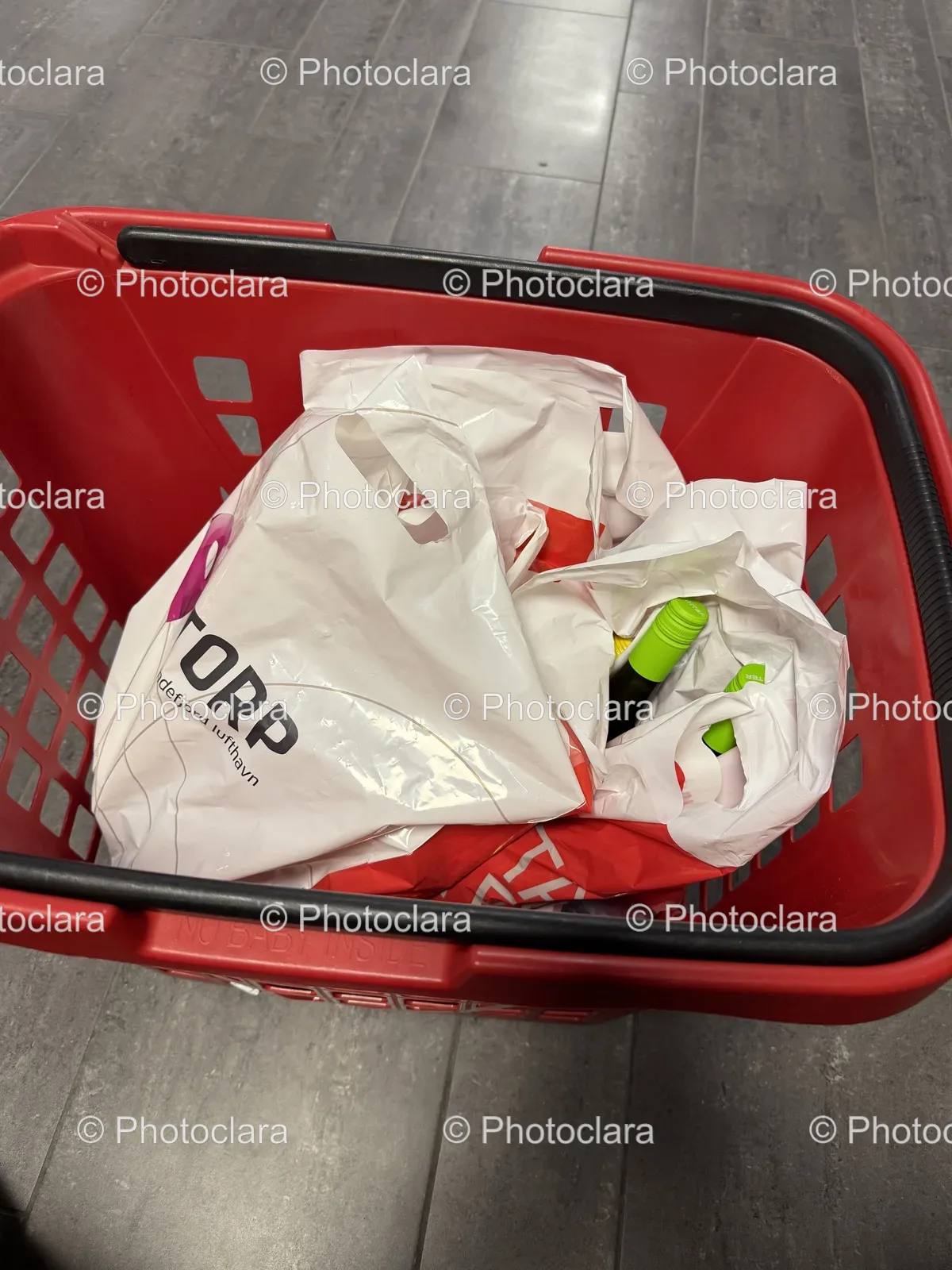 plastic-bags-and-bottle-in-a-shopping-basket.jpg