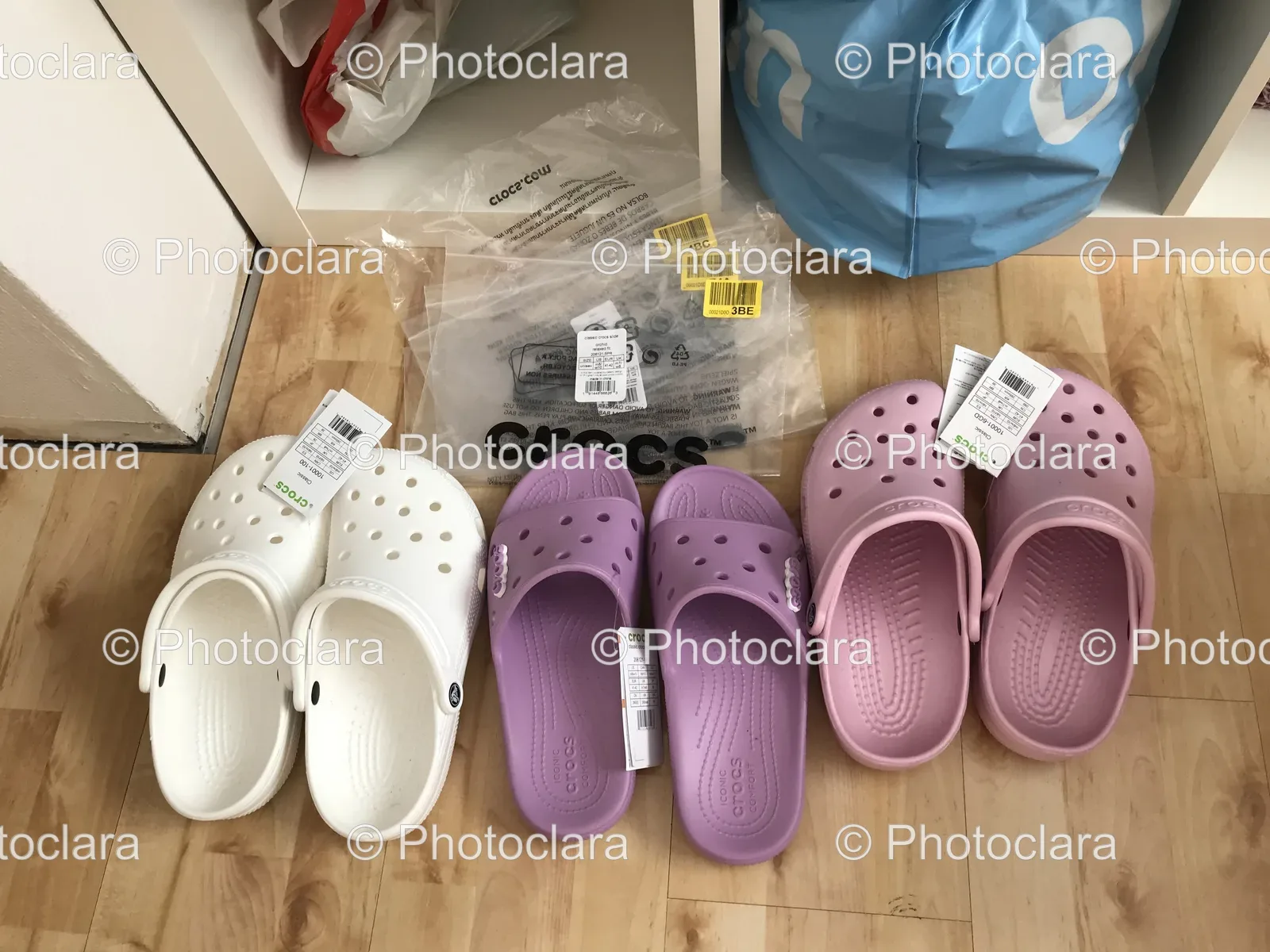 Group-of-Stylish-Crocs-on-Wooden-Floor.jpg