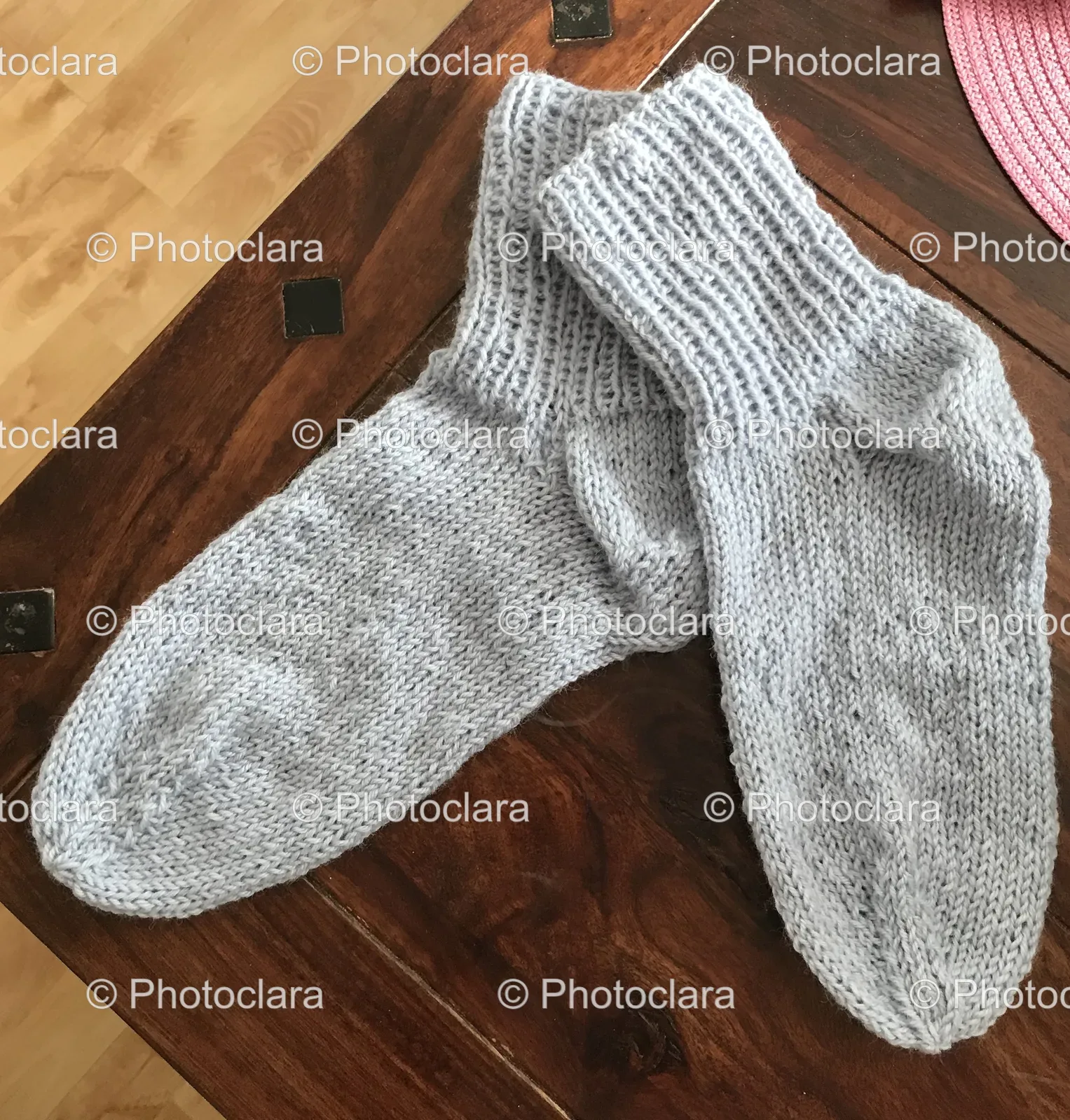 Pair-of-Grey-Socks-on-Wooden-Surface.jpg