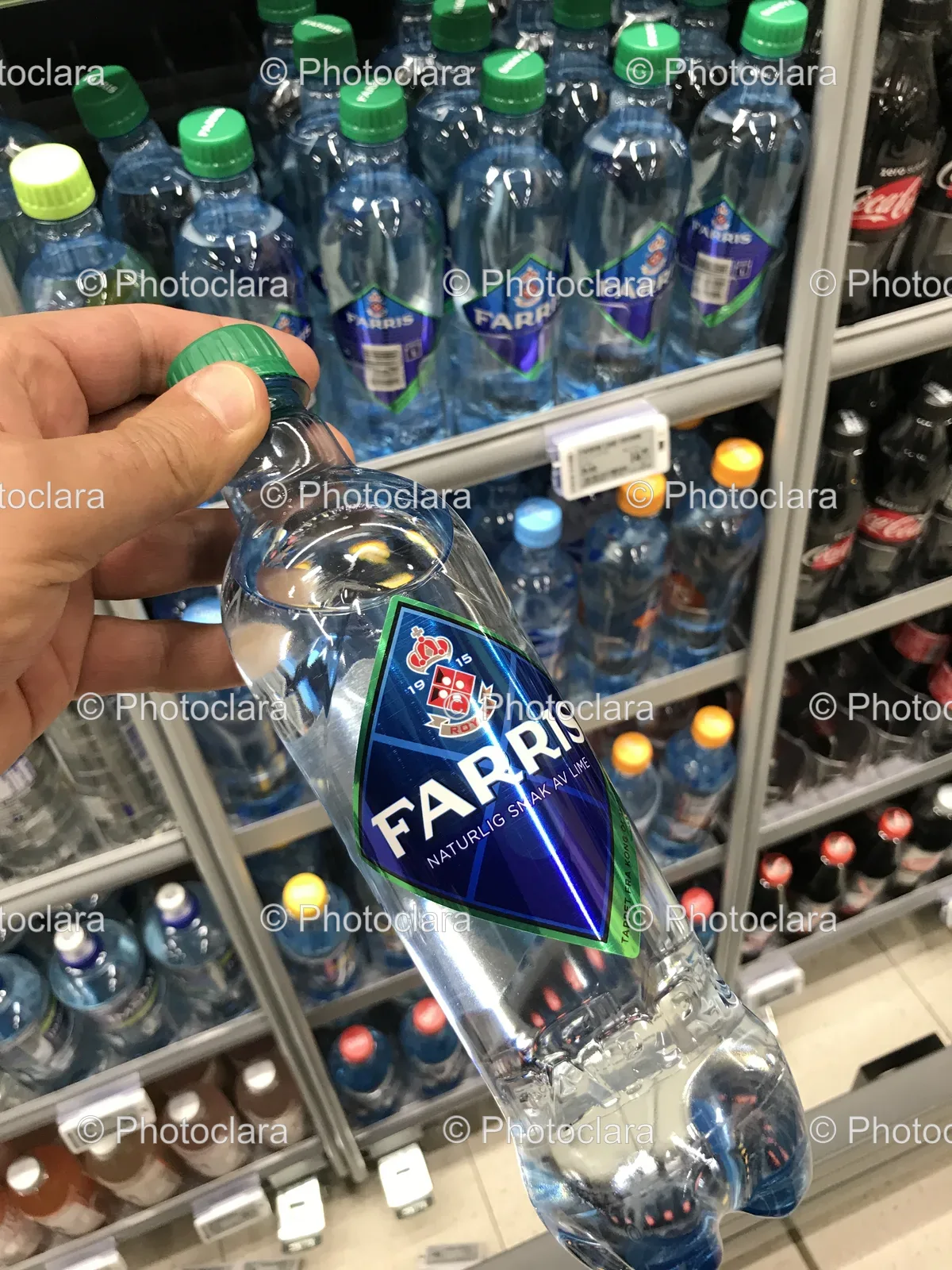 Hand-Holding-Bottle-Of-Water.jpg