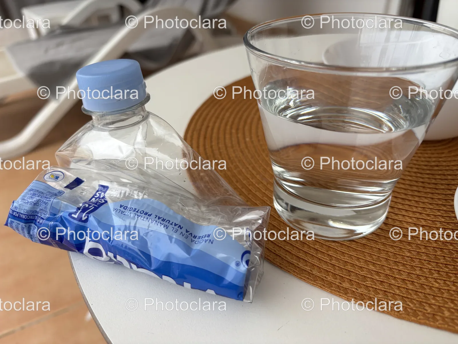 Plastic-Bottle-Glass-Water-on-Table.jpg
