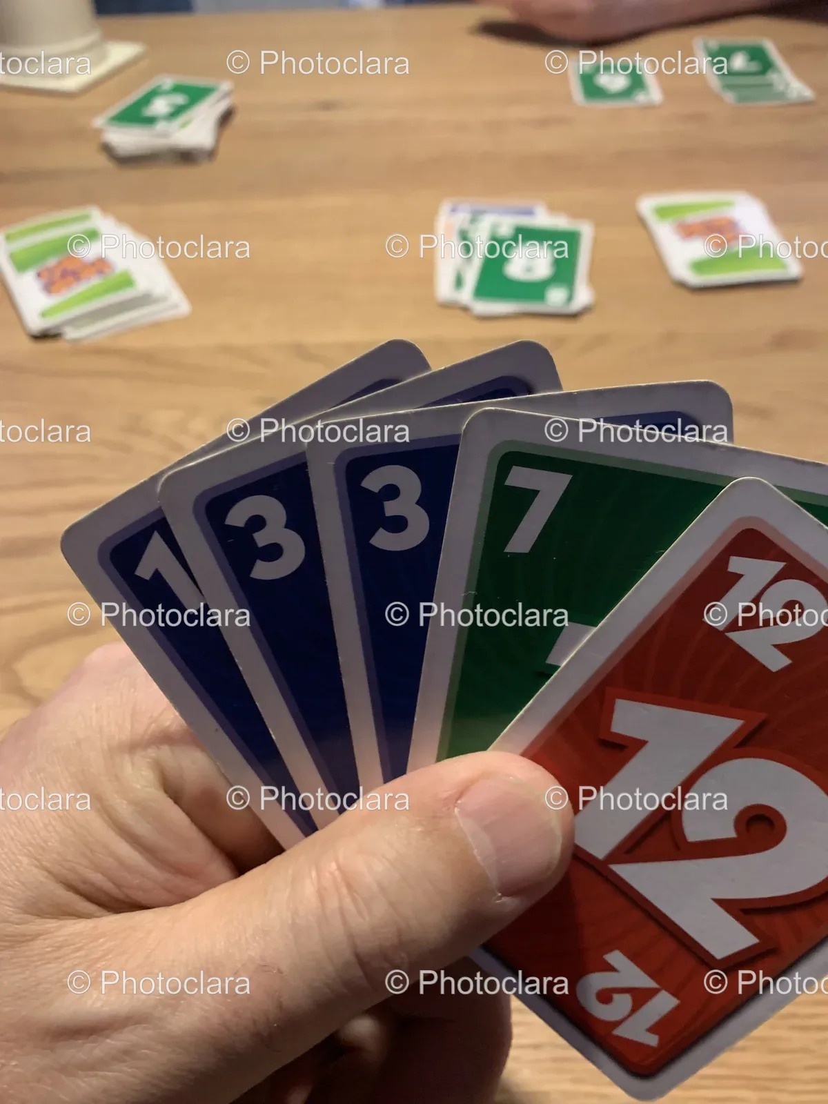 Hand-Holding-a-Card-Game.jpg