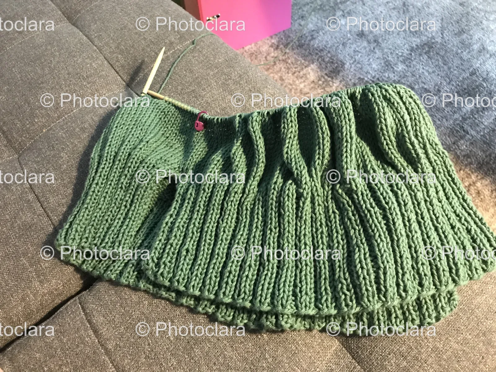 cozy-green-knitted-sweater-on-couch.jpg