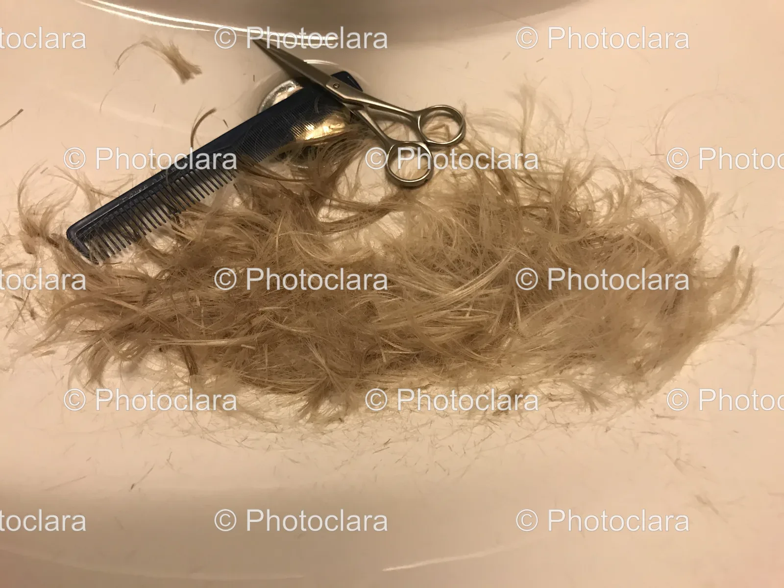 Scissors-and-Comb-on-White-Surface.jpg