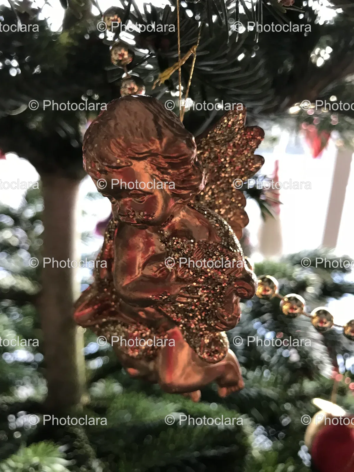 Gold-Angel-Ornament-on-Christmas-Tree.jpg