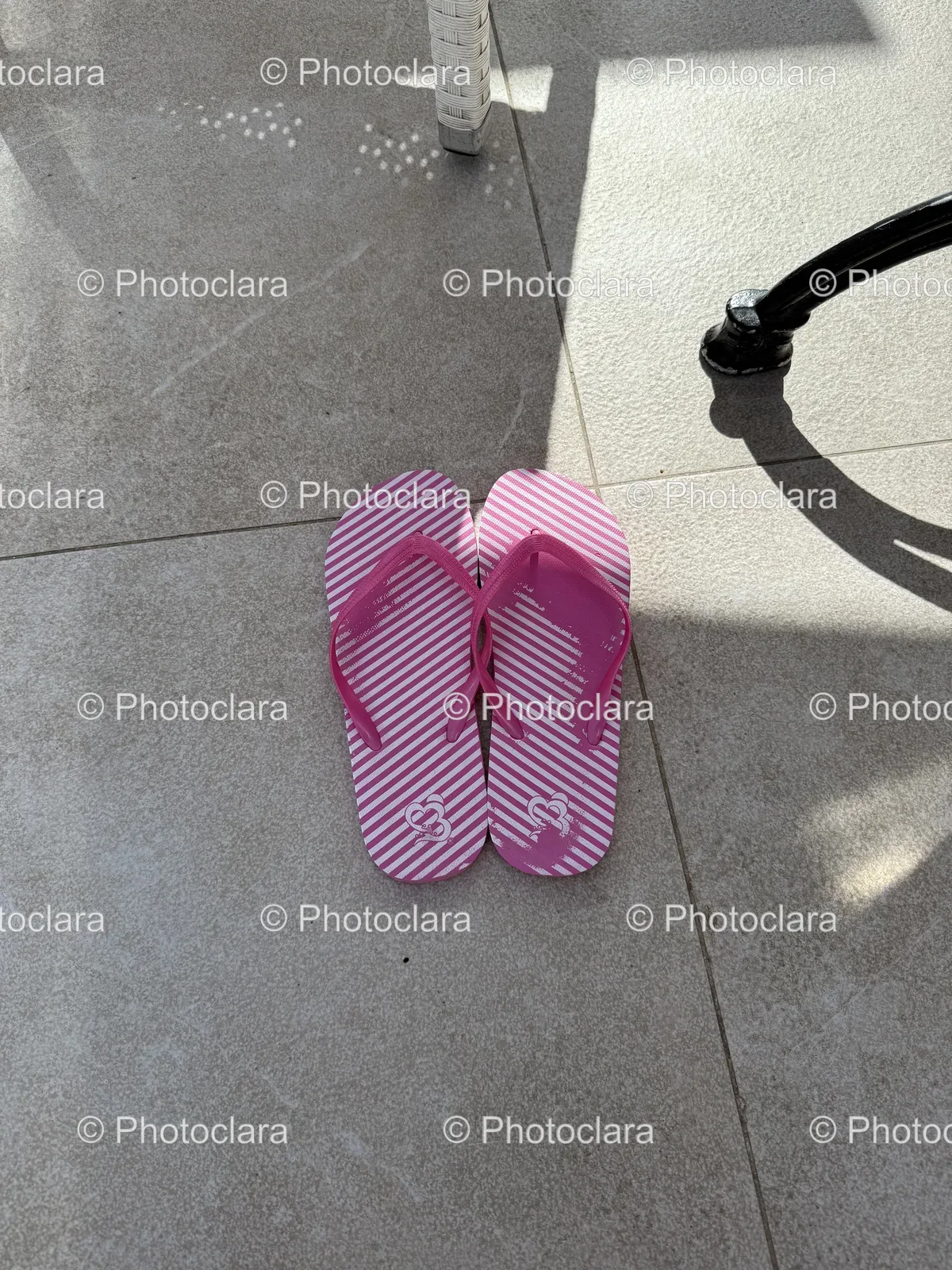 pink-and-white-flip-flops-tile-floor.jpg