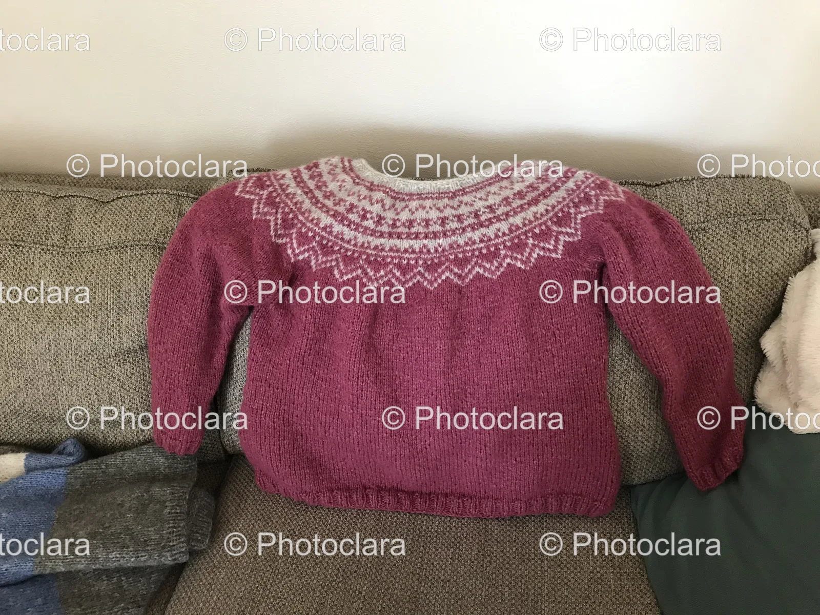 purple-red-sweater-on-couch.jpg