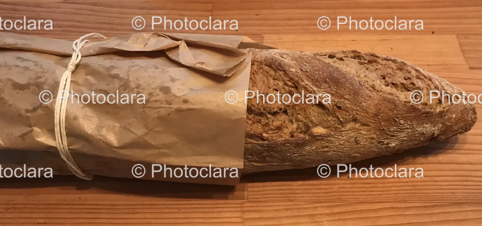 Loaf-of-Sourdough-Bread-Wrapped-in-Paper.jpg