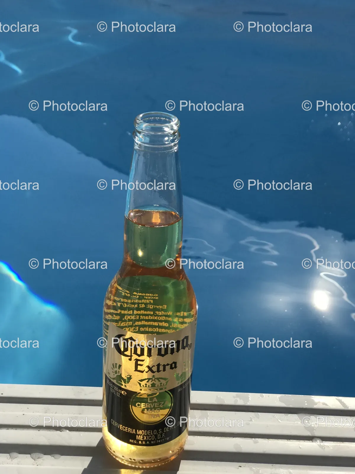 Bottle-of-Corona-Beer-by-the-Pool.jpg