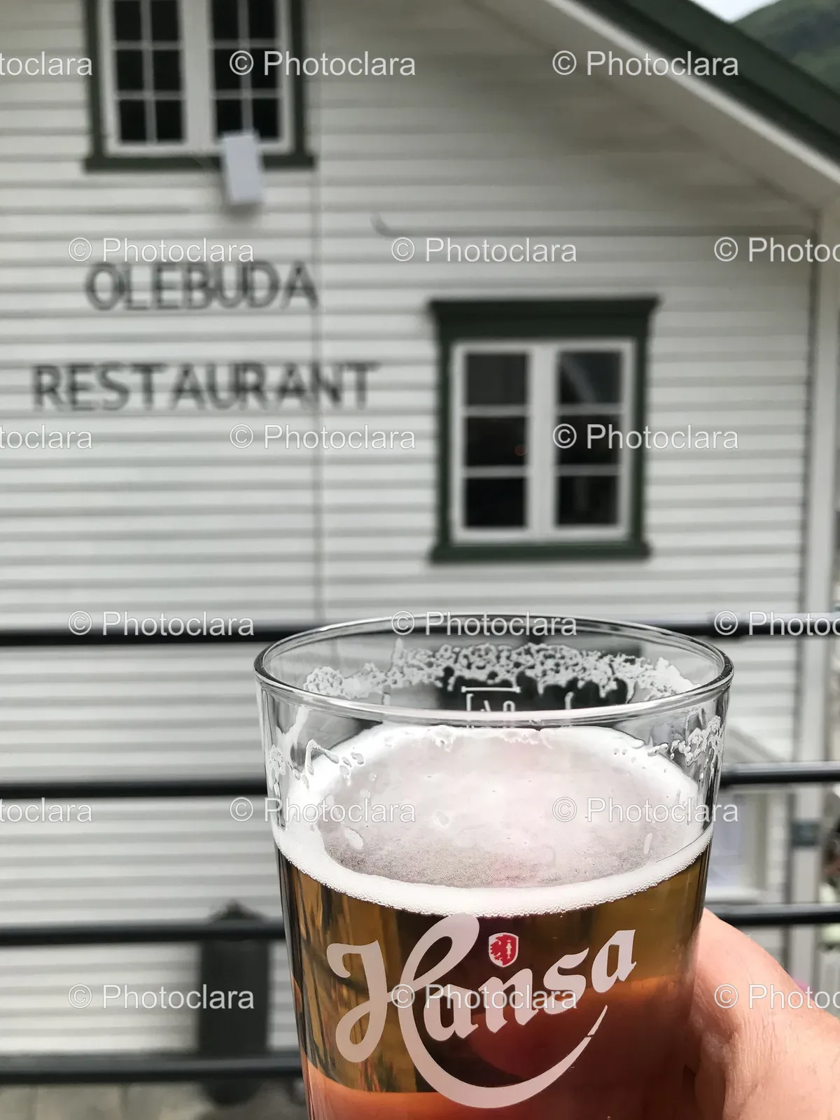 Hand-Holding-Glass-of-Beer-at-OLEBUDA-Restaurant.jpg
