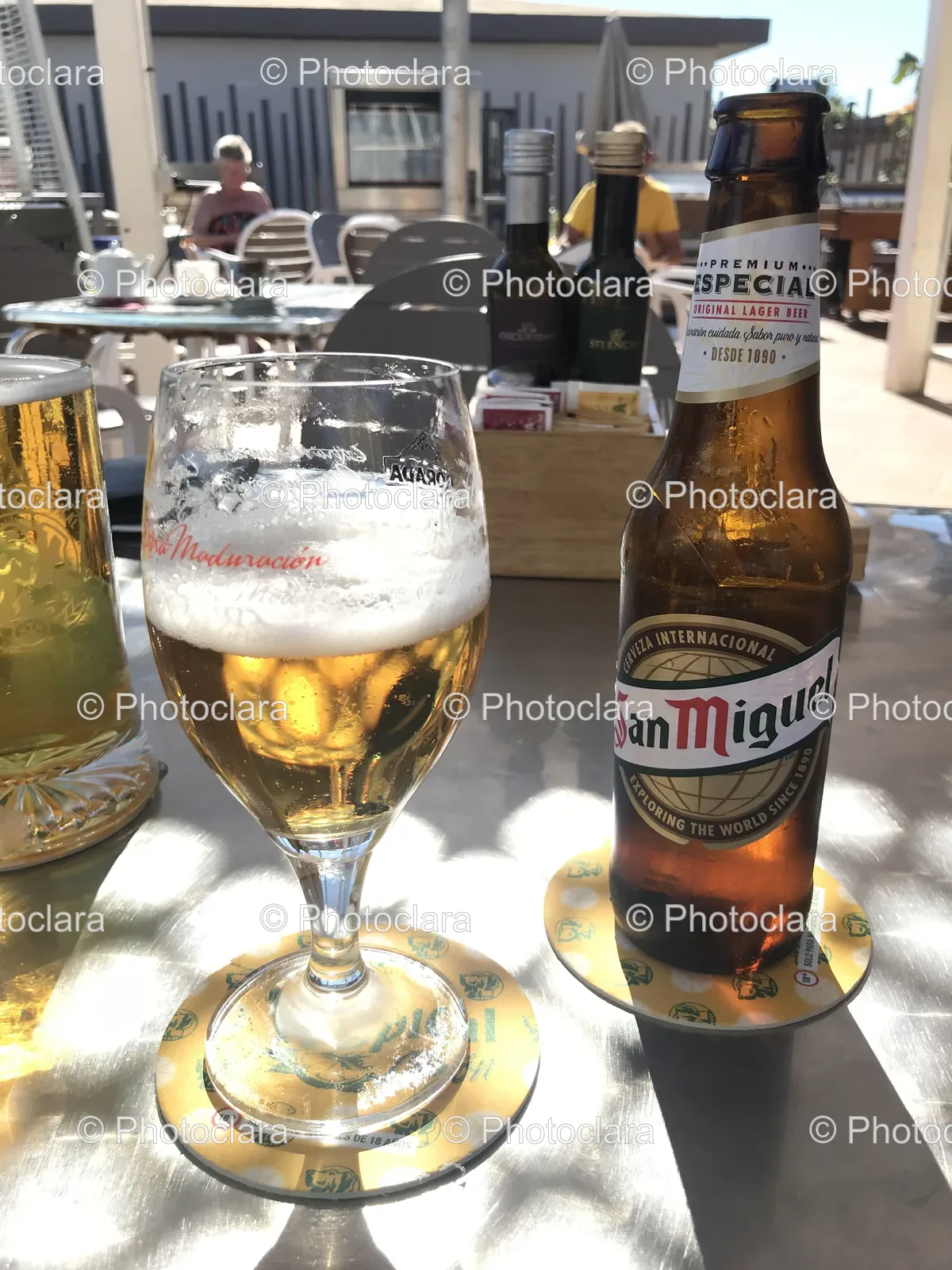 Refreshing-Glass-of-Beer-Next-to-Premium-Bottle.jpg