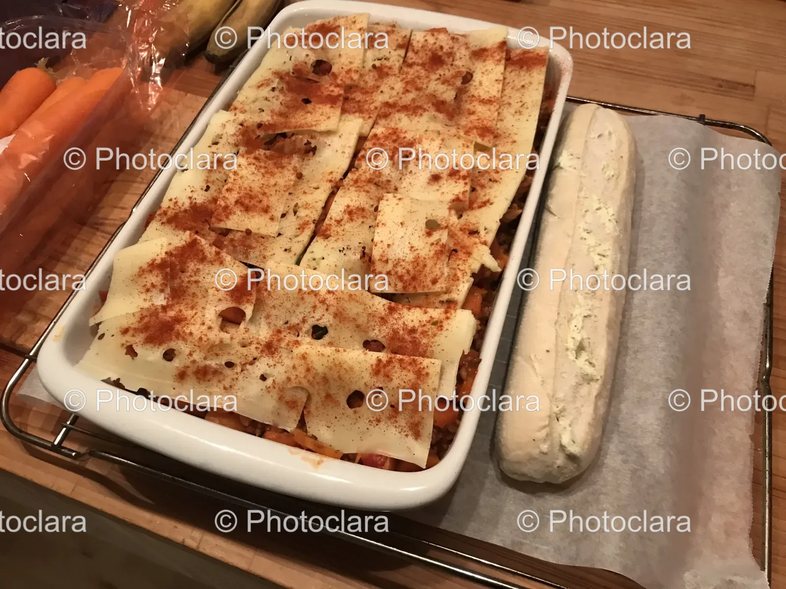 cheesy-casserole-in-white-dish-with-baguette.jpg