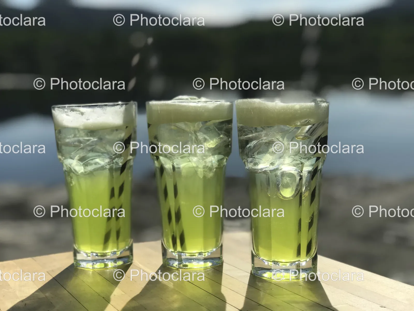 glasses-with-liquid-and-straws-on-table.jpg