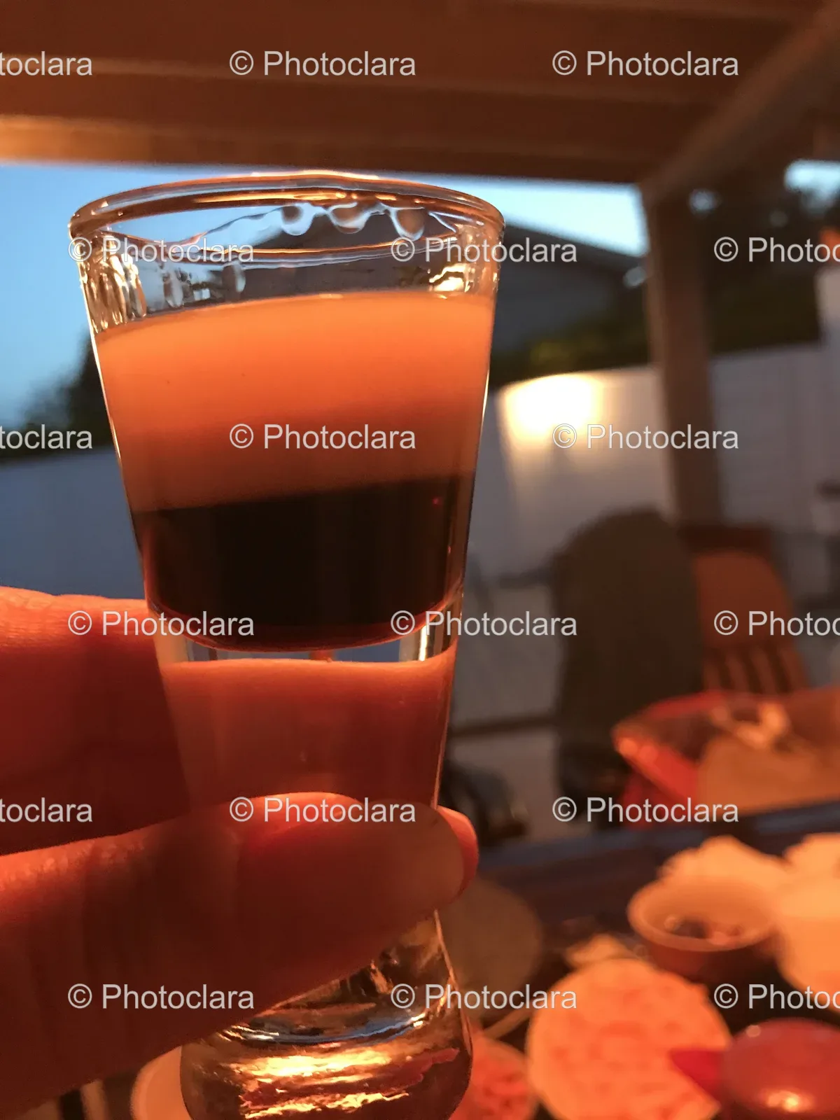 hand-holding-a-shot-glass.jpg