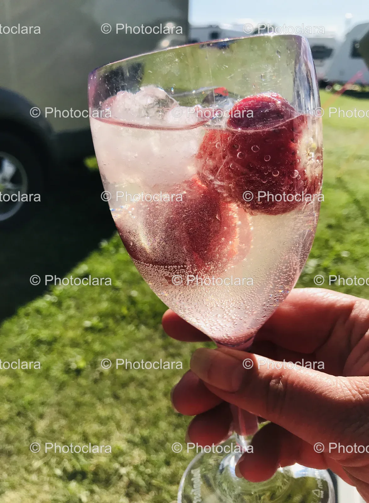 hand-holding-glass-of-water-with-fruit.jpg