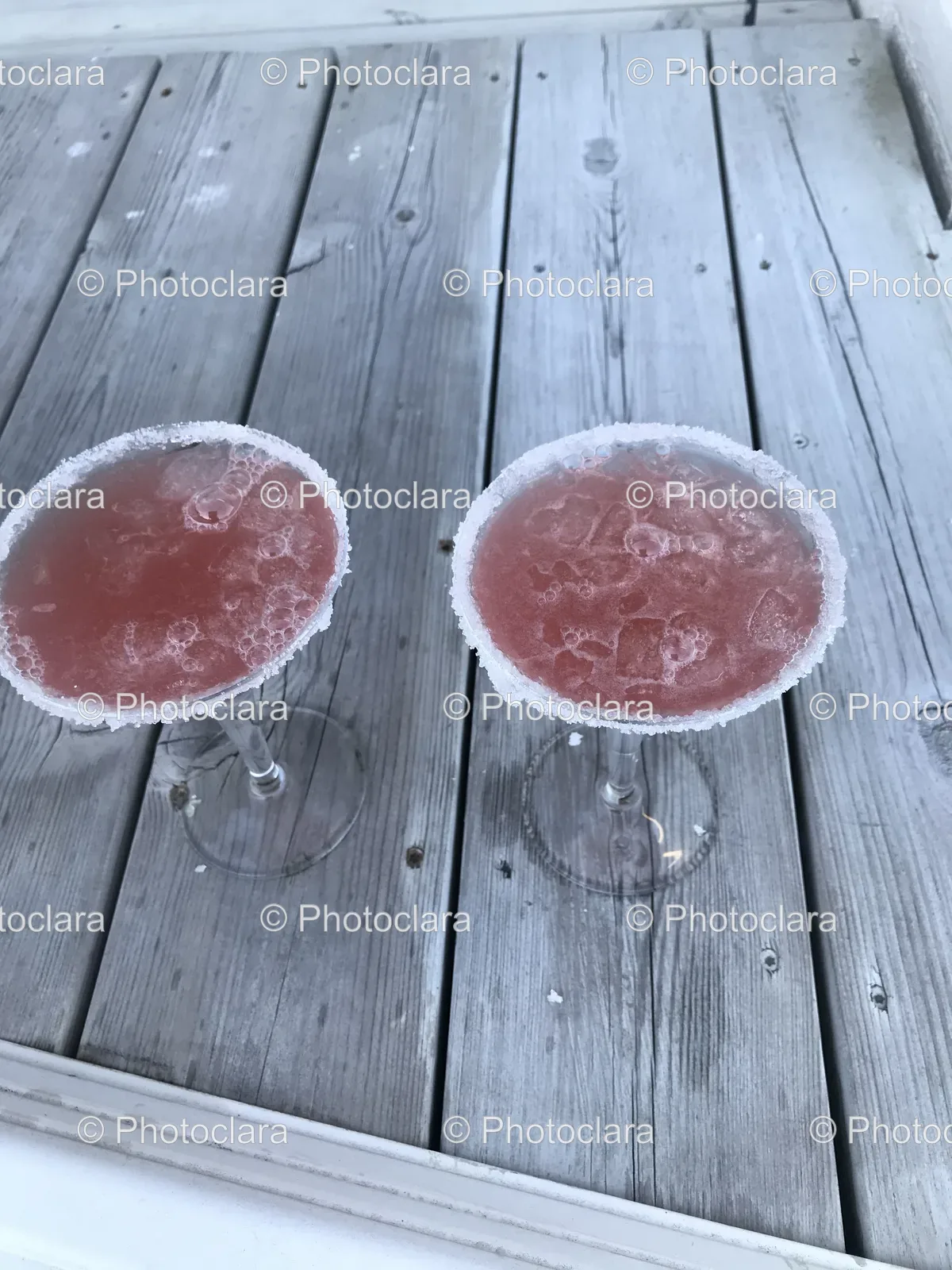 refreshing-pink-cocktails-on-wooden-table.jpg