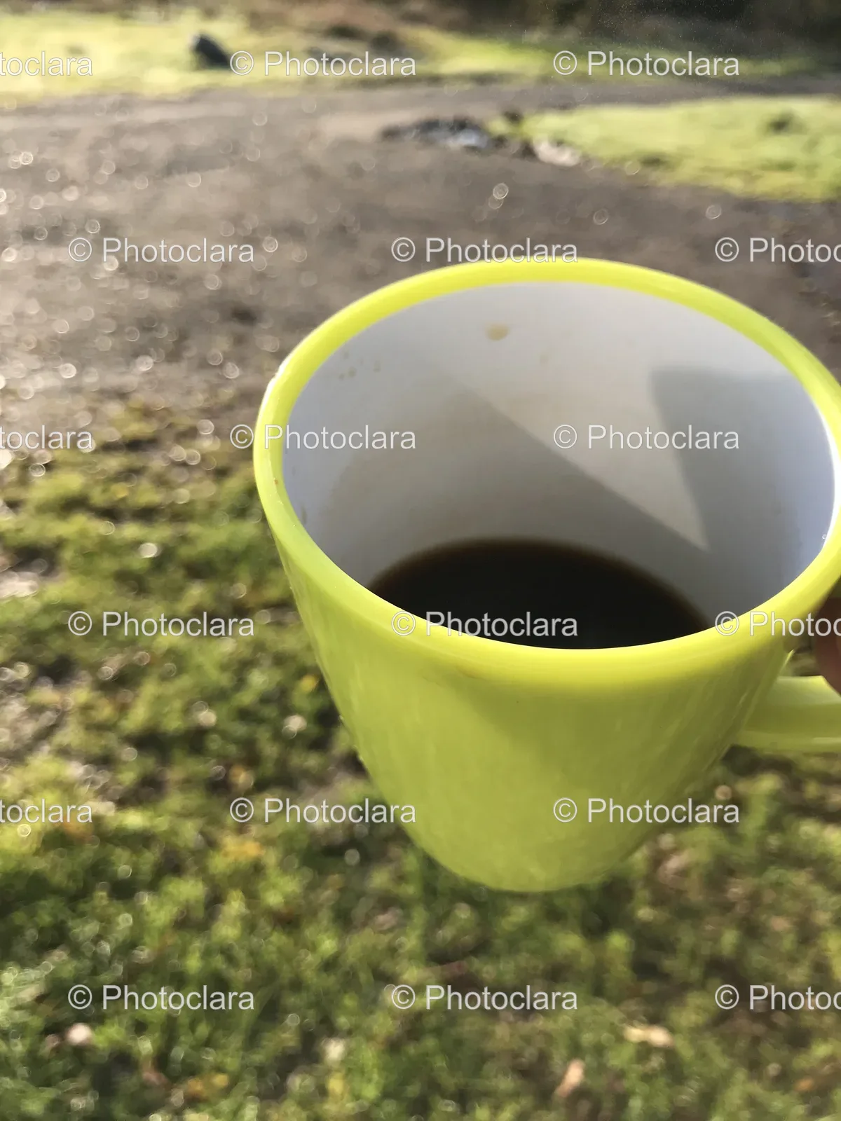 Hand-Holding-Cup-of-Coffee-Outdoor.jpg