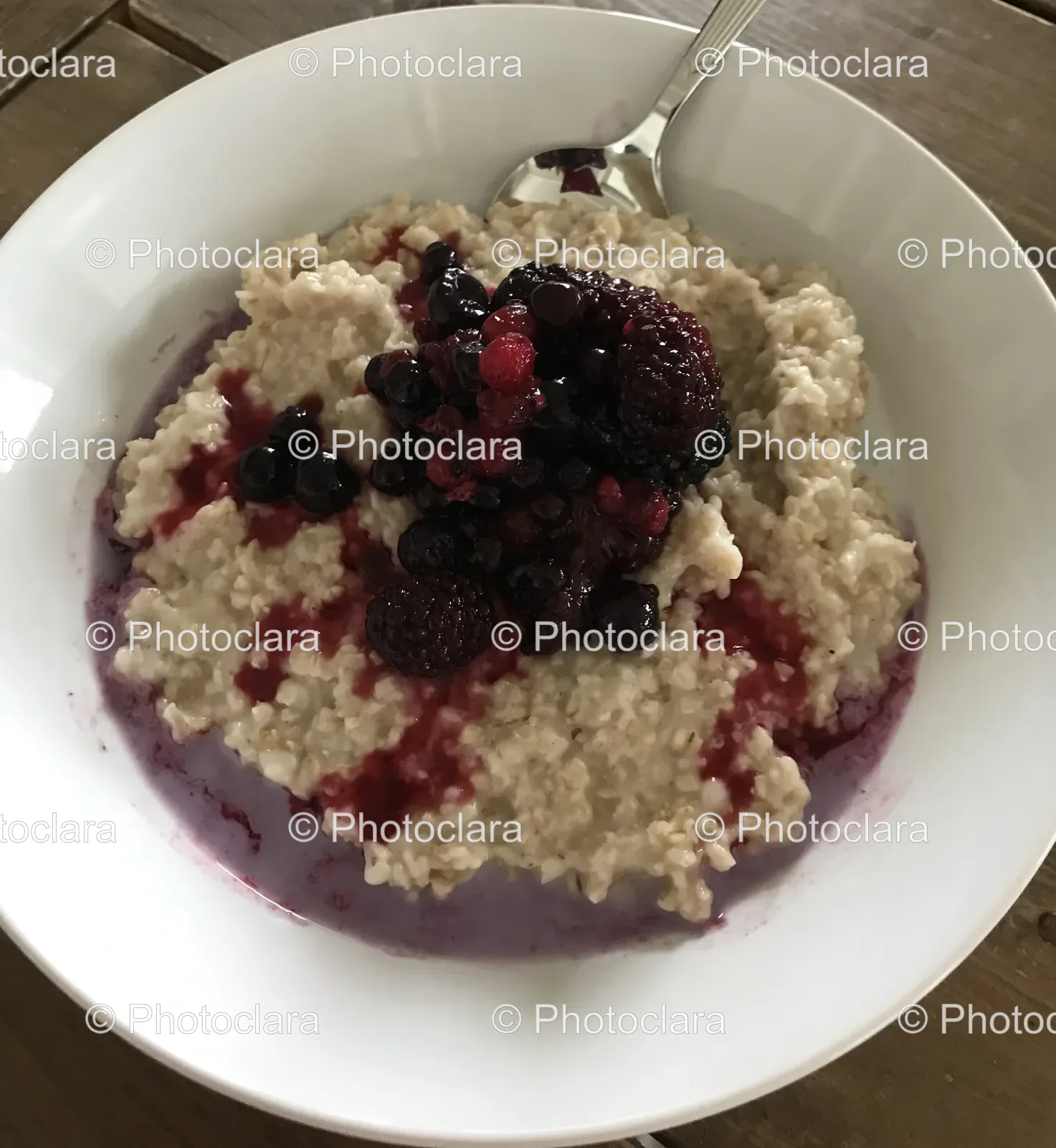 bowl-of-oatmeal-with-berries-and-spoon.jpg