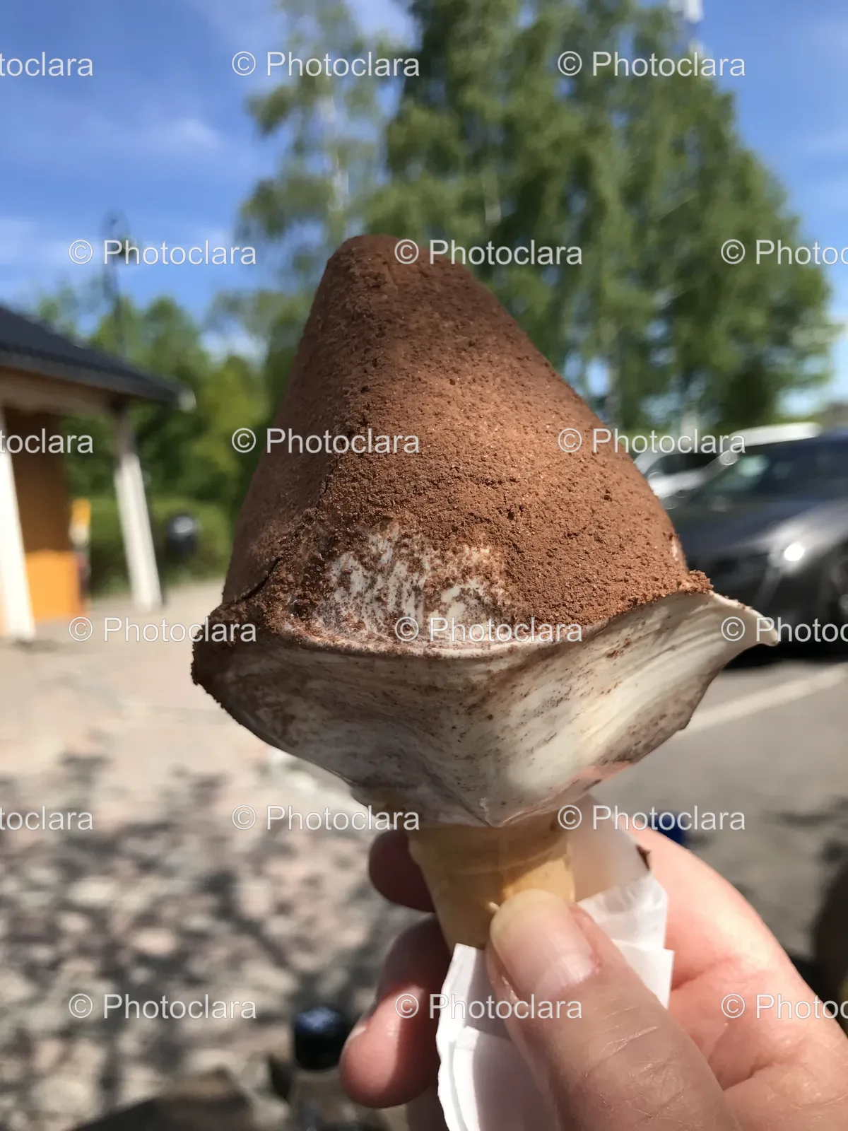 Hand-Holding-Ice-Cream-Cone-Brown-Powder.jpg