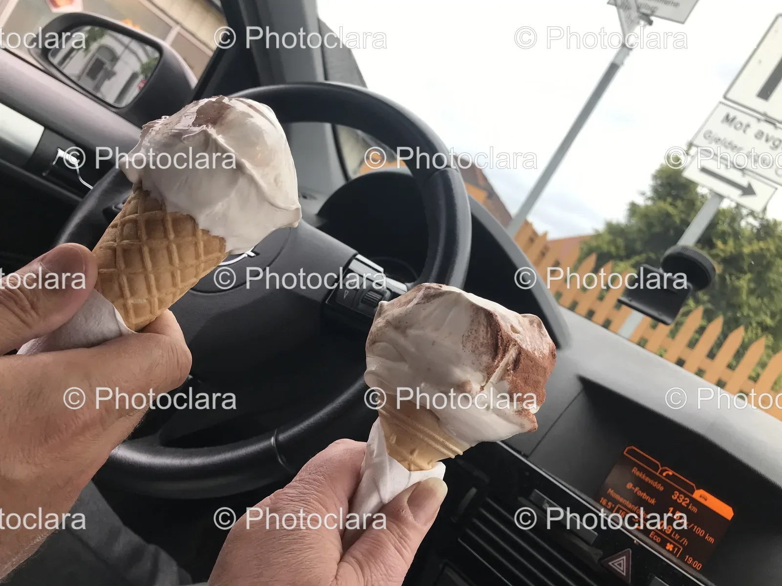 Two-Hands-Holding-Ice-Cream-Cones-in-a-Car.jpg