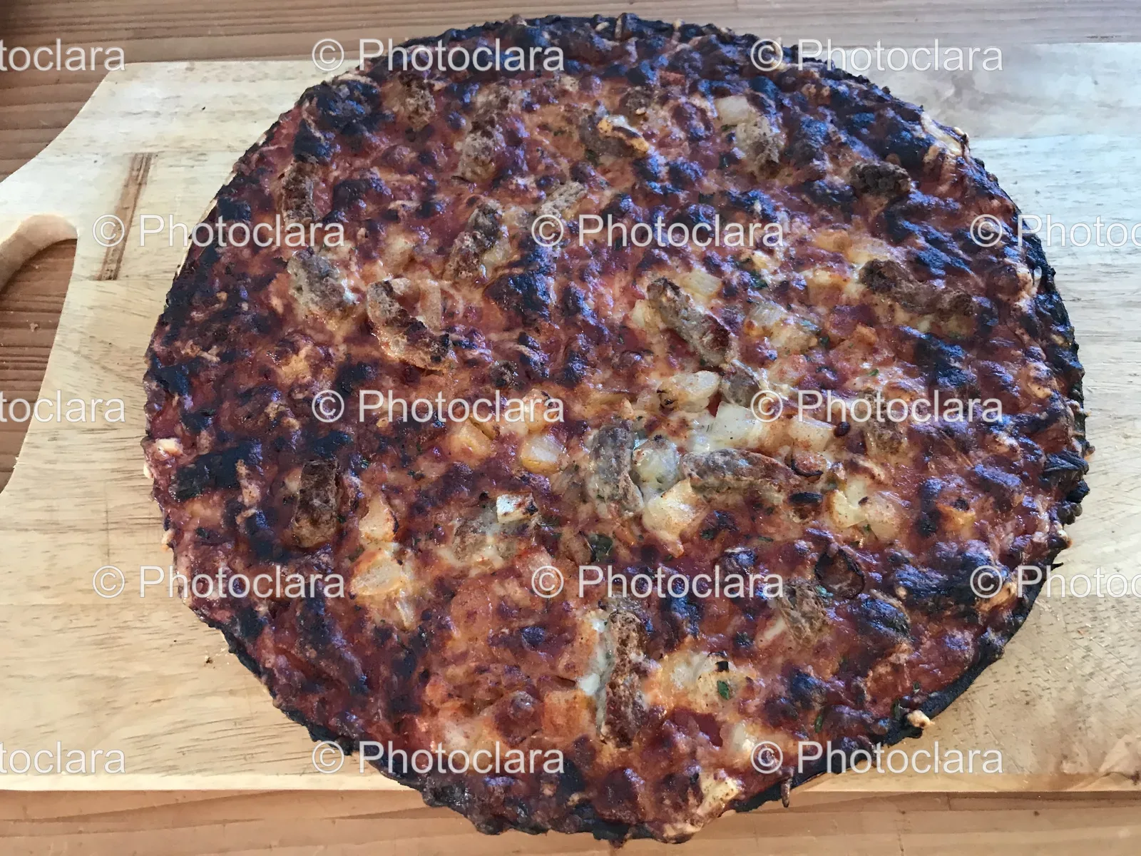 delicious-pizza-on-wooden-board.jpg