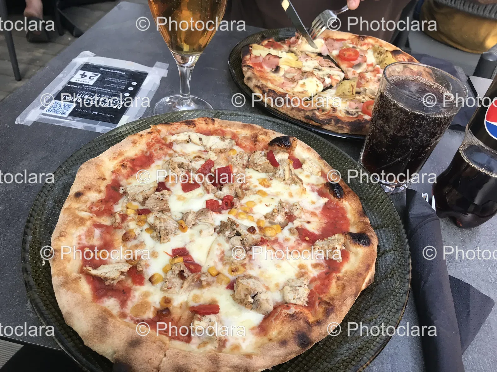 delicious-pizza-with-a-drink-by-the-table.jpg