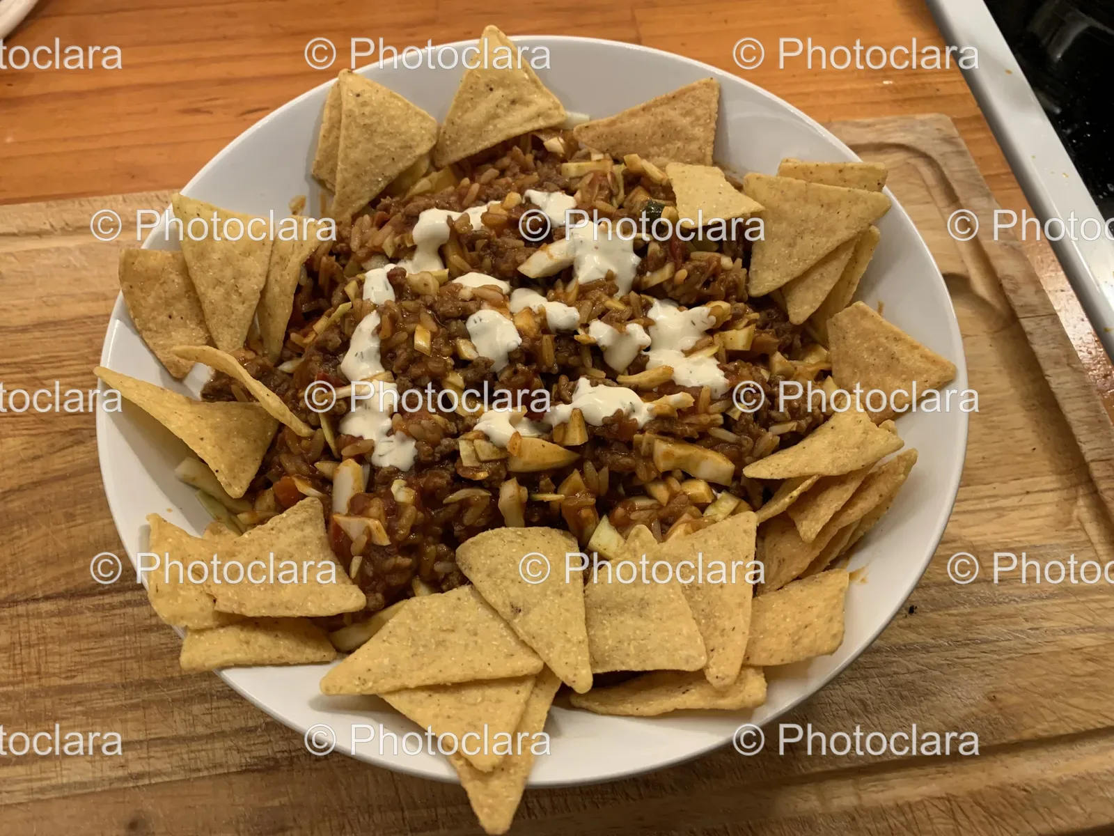 bowl-of-nachos-on-wooden-surface.jpg
