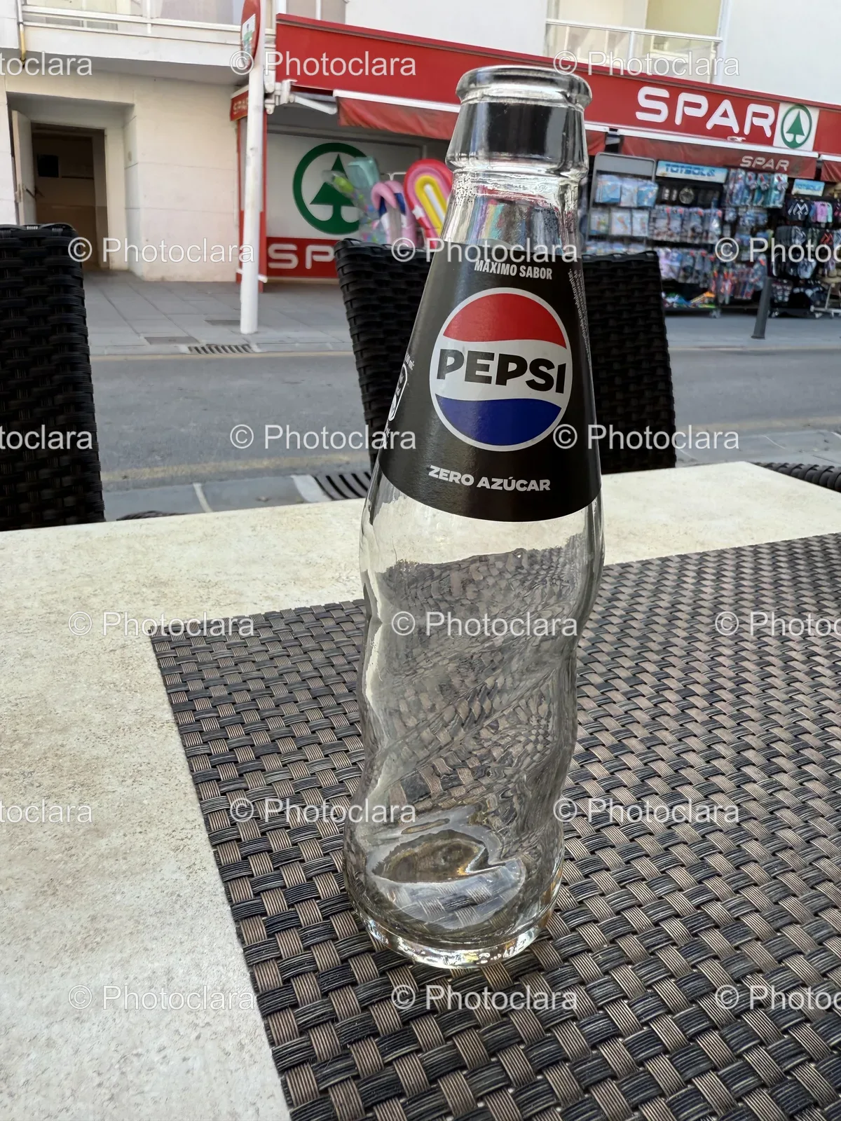Empty-Pepsi-Soda-Bottle-on-a-Table.jpg