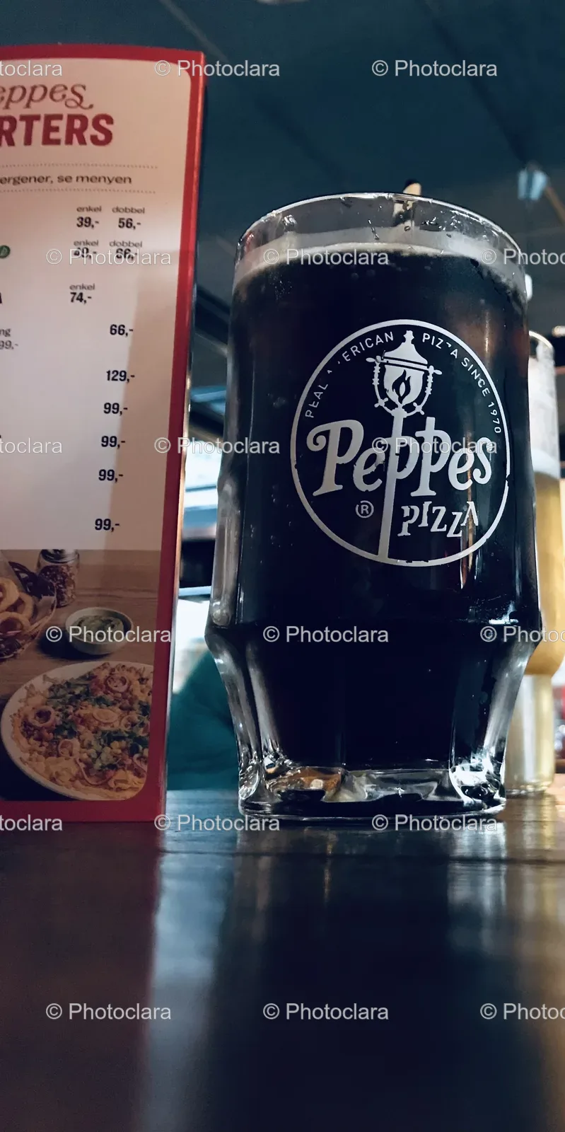 Glass-of-Dark-Liquid-on-a-Menu-Board.jpg