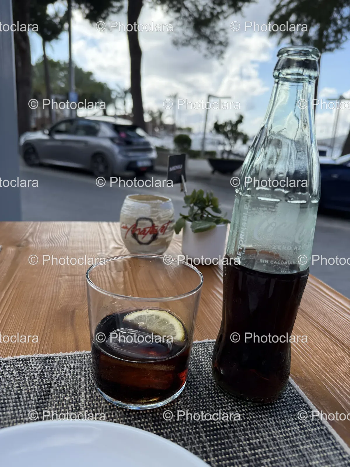 Refreshing-Soda-and-Glass-on-Outdoor-Table.jpg