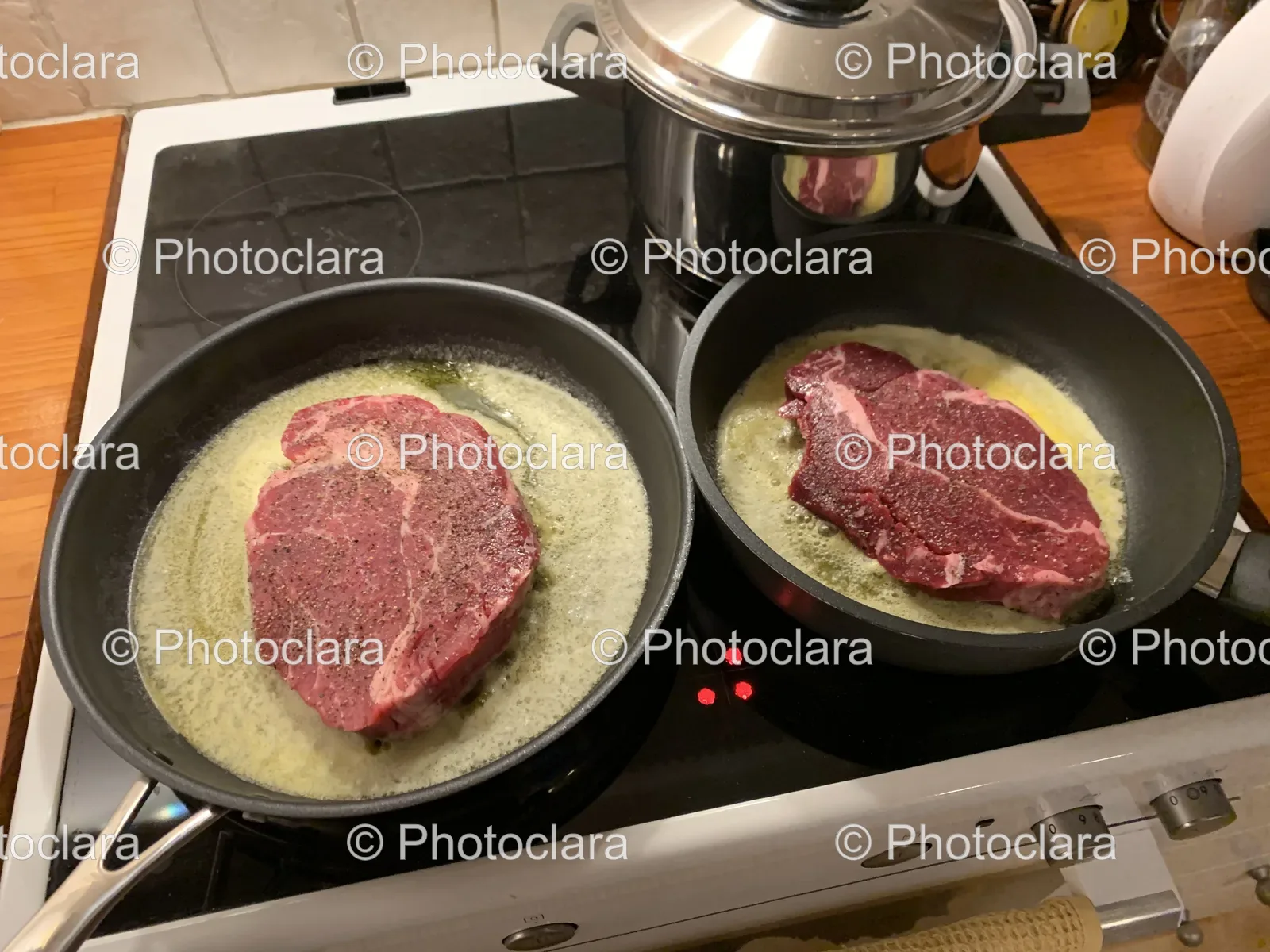 two-pans-of-meat-on-stove.jpg