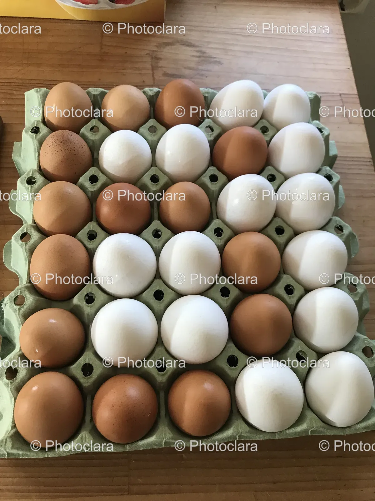 carton-of-eggs-on-wooden-table.jpg