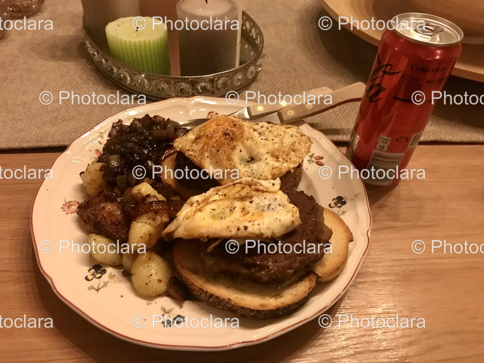 a-plate-of-food-with-a-can-of-soda-and-candles.jpg