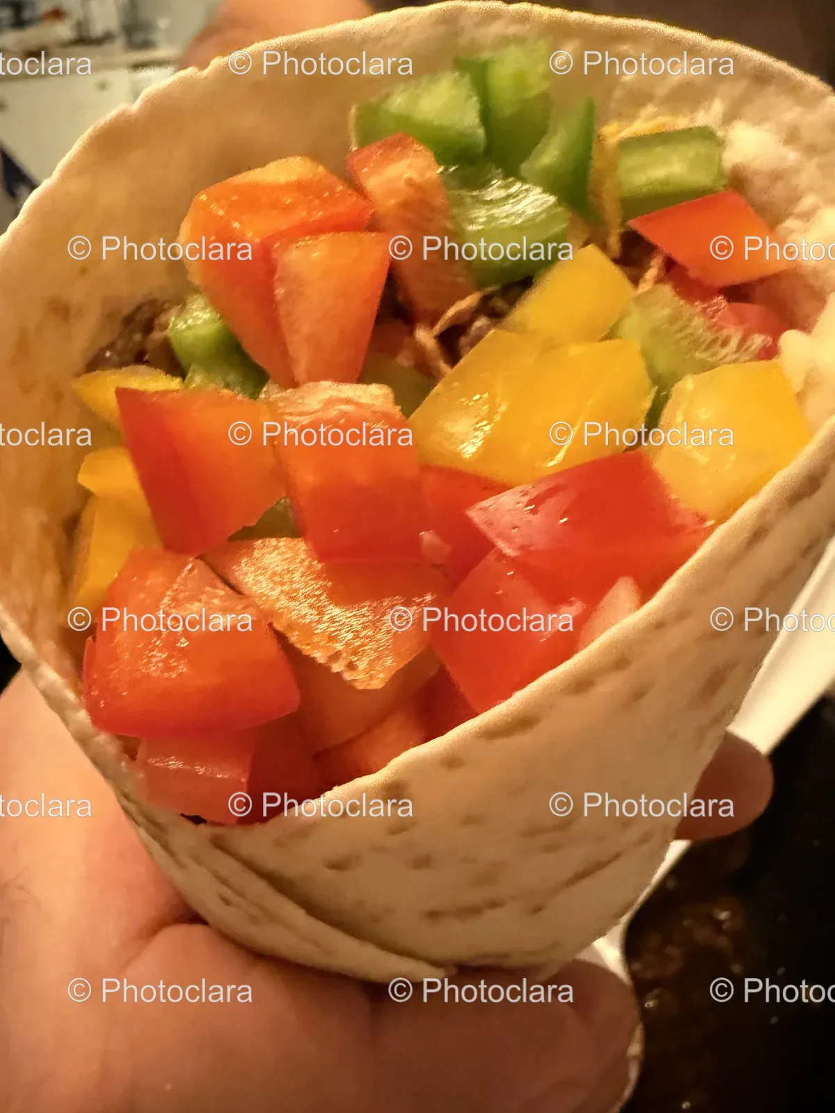 Hand-Holding-Vibrant-Vegetable-Tortilla.jpg
