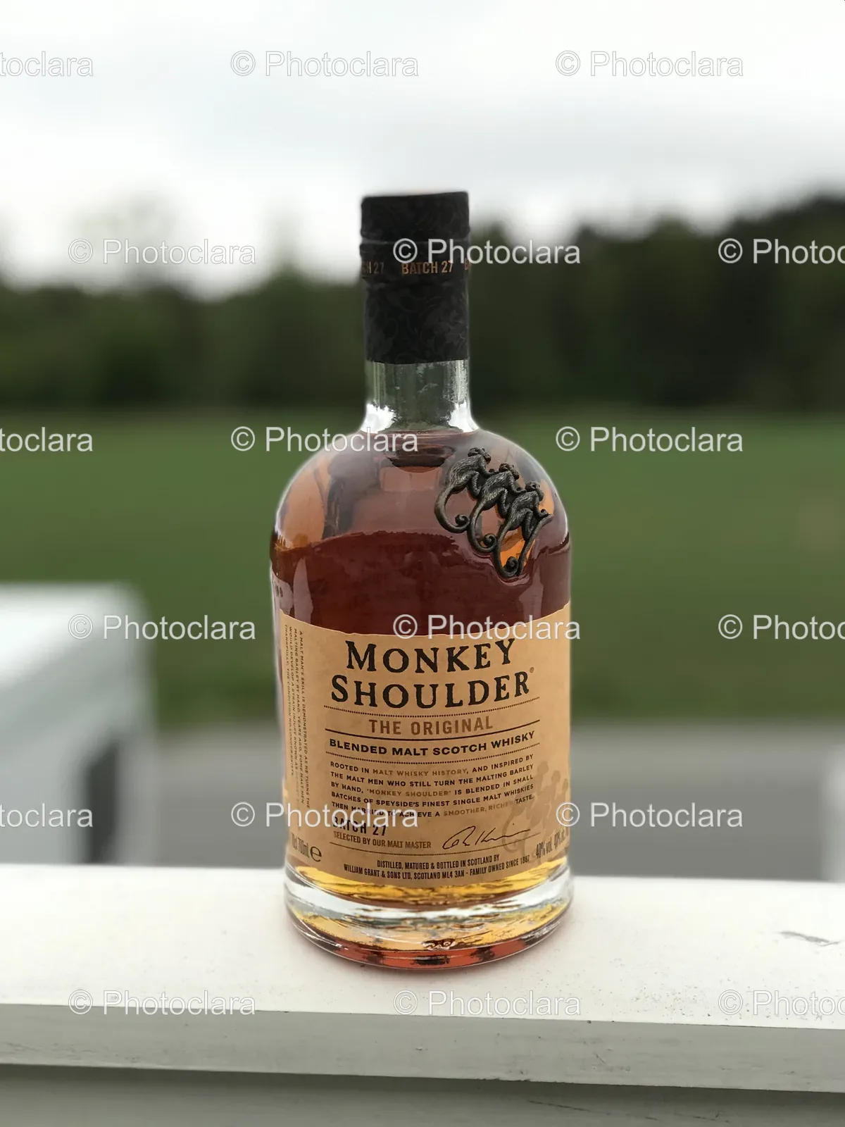 bottle-of-alcohol-on-a-railing.jpg
