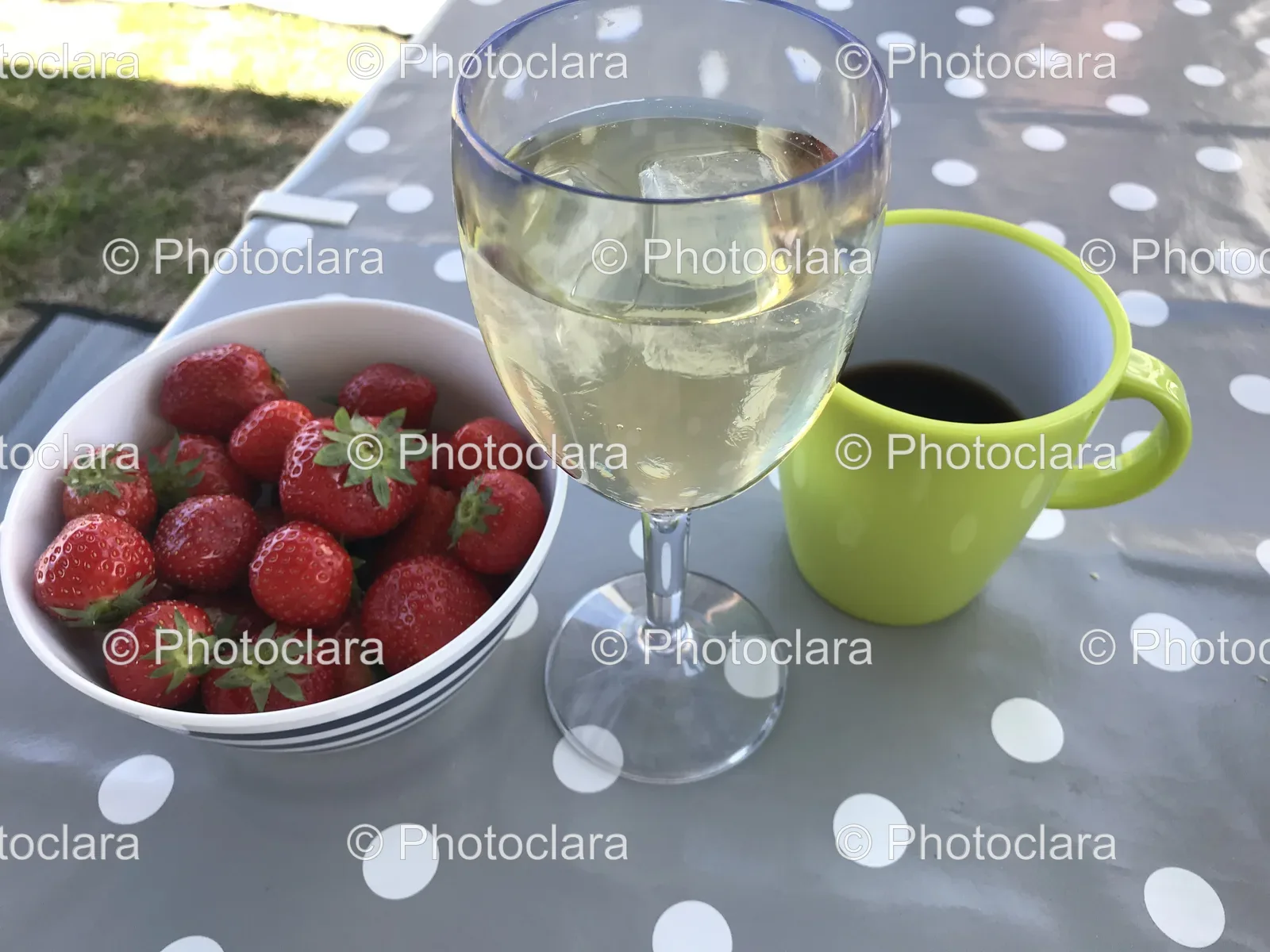 Glass-of-Wine-and-Bowl-of-Strawberries-on-a-Table.jpg