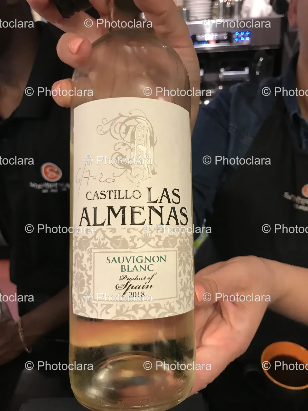 Person-Holding-Castillo-Las-Almenas-Sauvignon-Blanc-Wine-Bottle.jpg