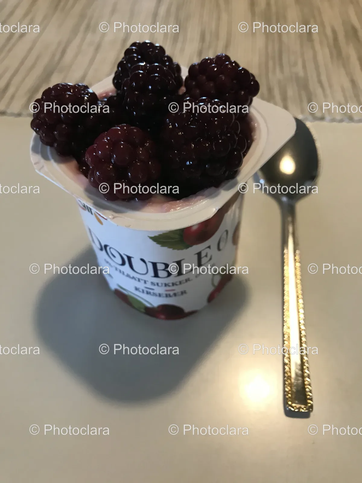 cup-of-yogurt-with-berries-and-spoon.jpg