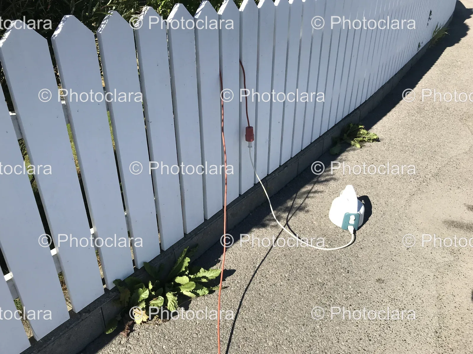Charming-White-Picket-Fence-with-Red-Cord.jpg