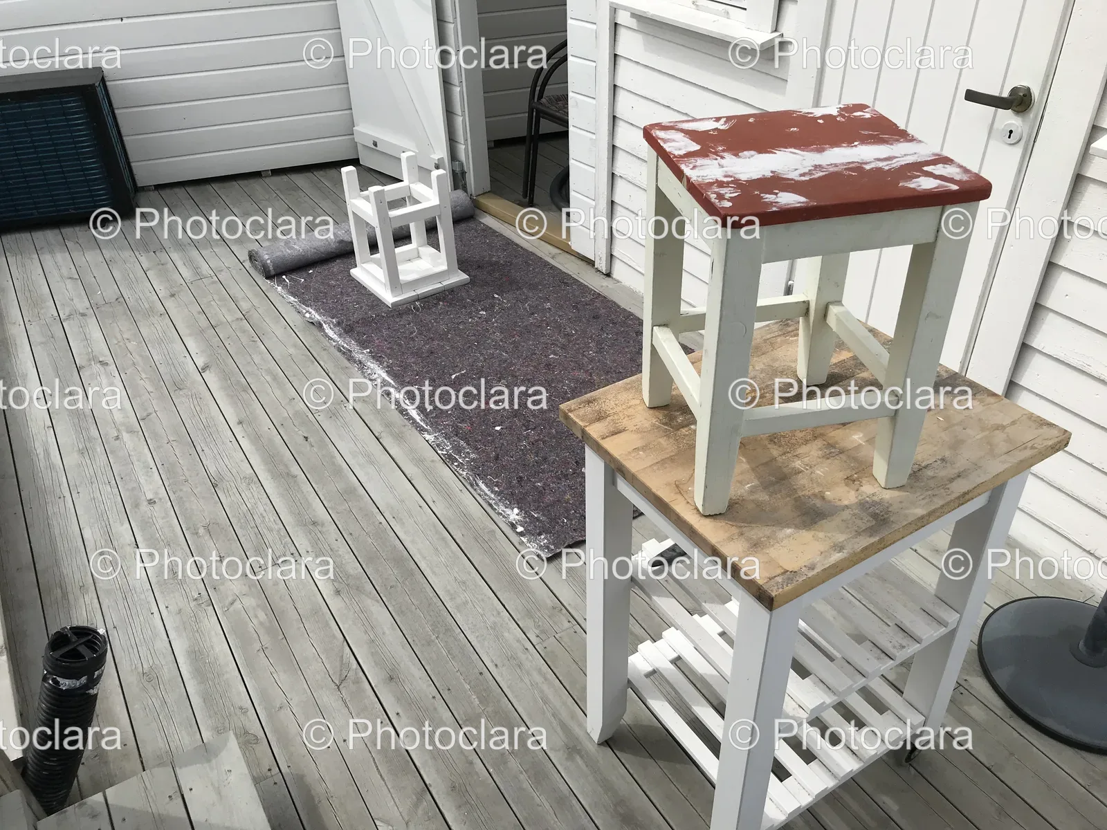 white-stool-on-wooden-surface.jpg