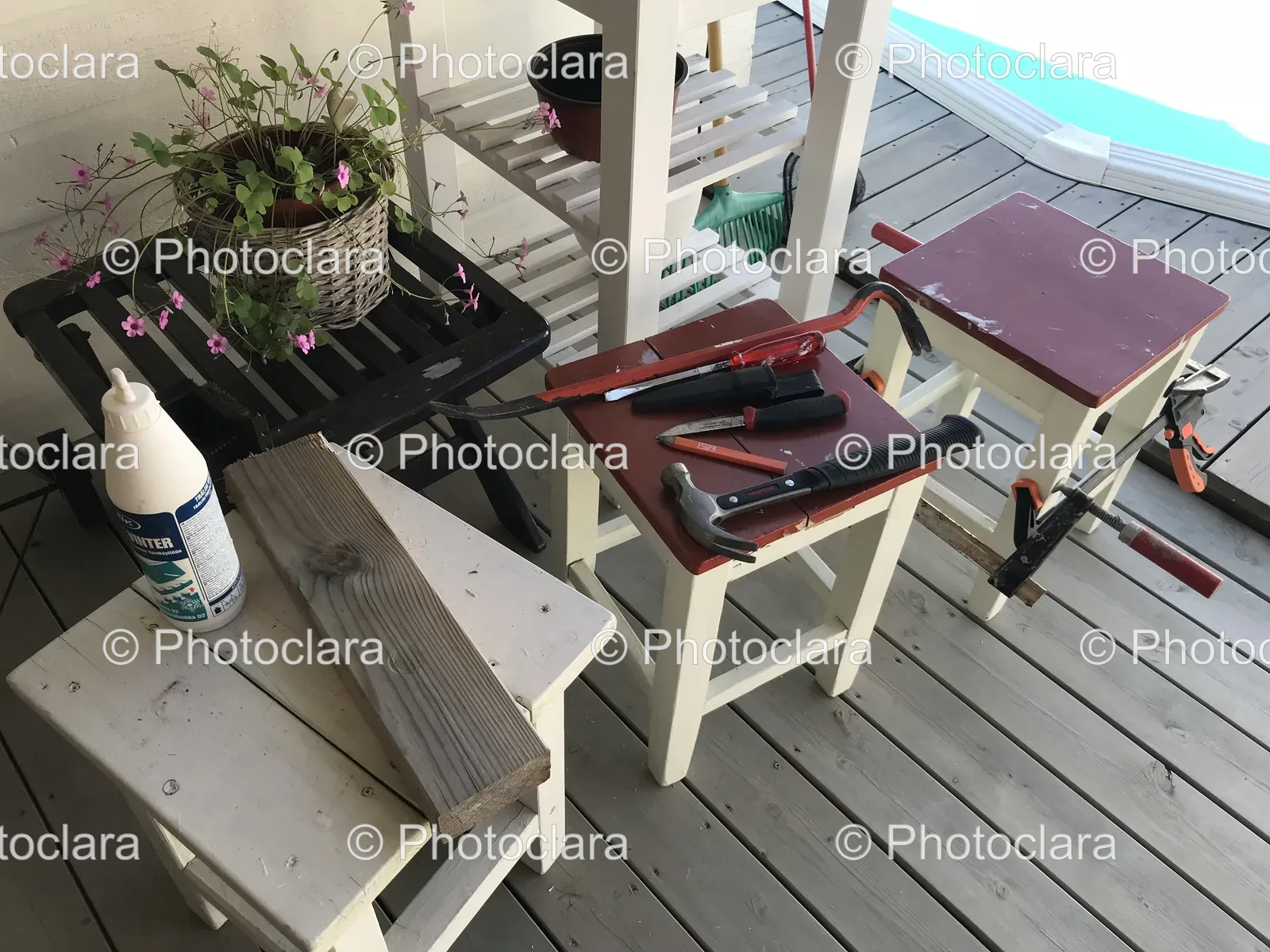 assorted-tools-on-wooden-deck-bench.jpg