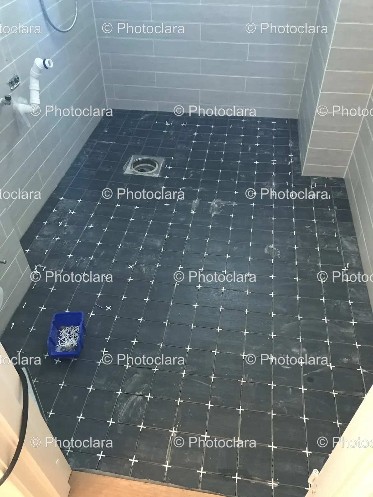 modern-bathroom-tile-floor-blue-bucket.jpg