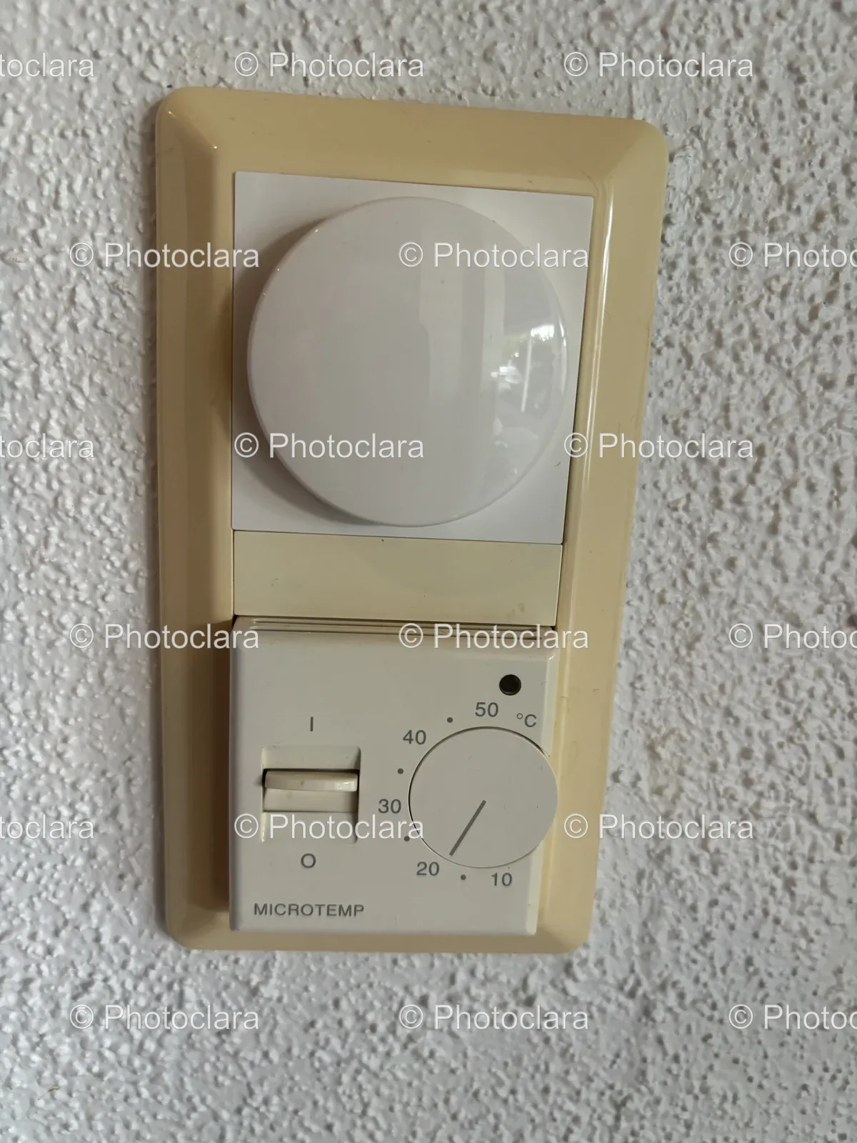 white-round-switch-on-wall.jpg